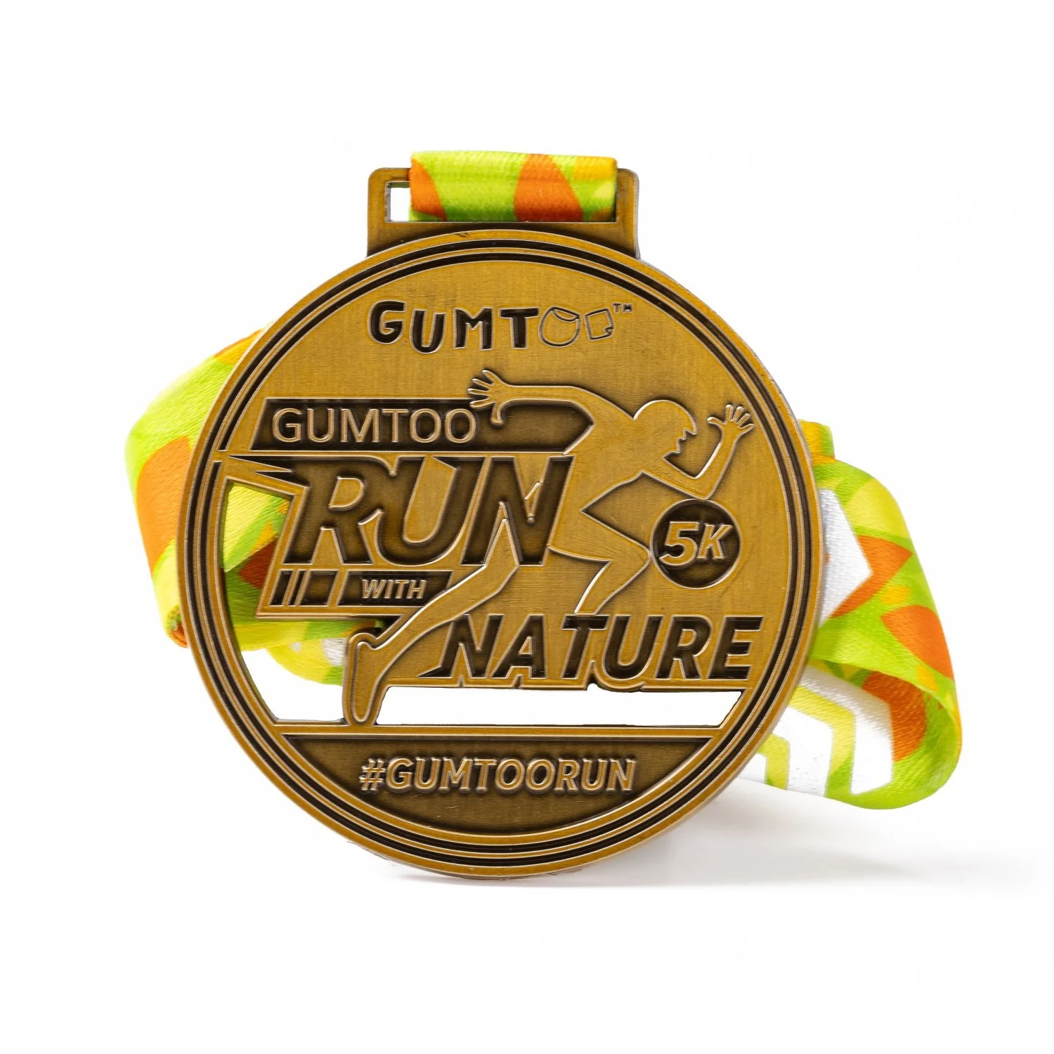 Die struck antique gold running medal with a runner in relief, on a yellow and orange ribbon