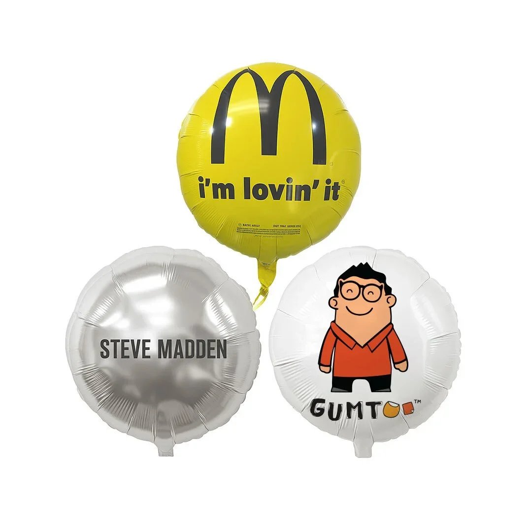 Round custom foil balloons in yellow, silver and white printed with  brand logos, long-lasting helium balloons for corporate events, retail merchandise Malaysia