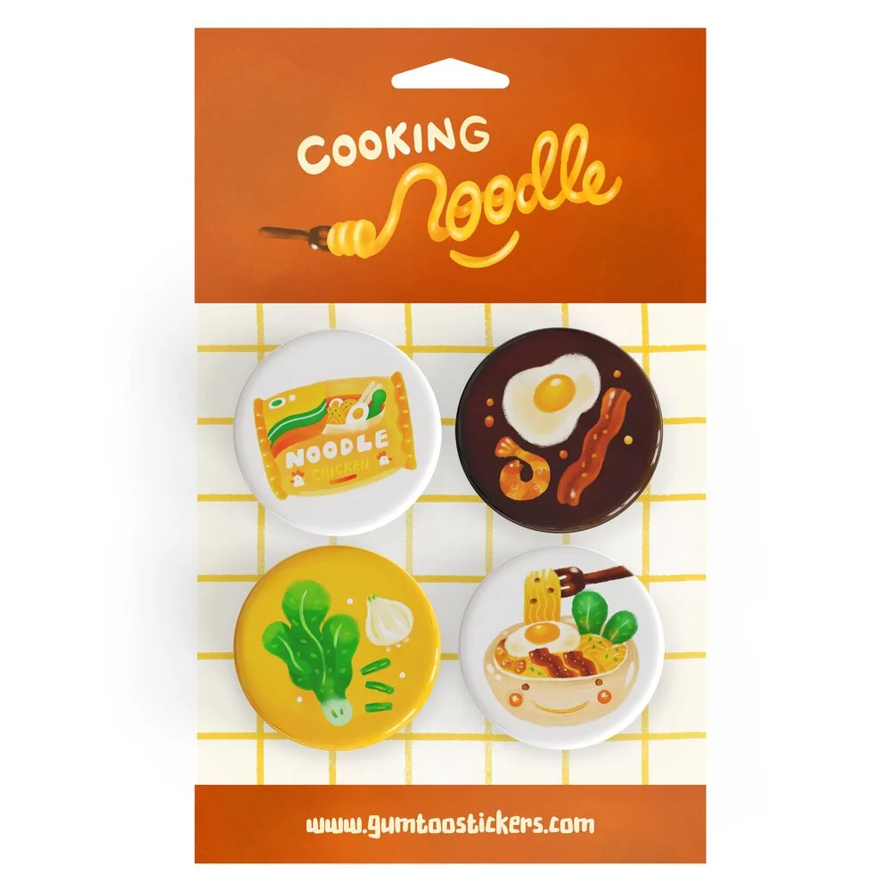 Food design button badges mounted on a printed backing card