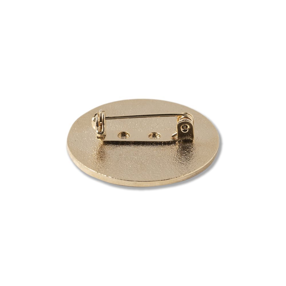 Safety pin backing attached to the rear of an enamel pin