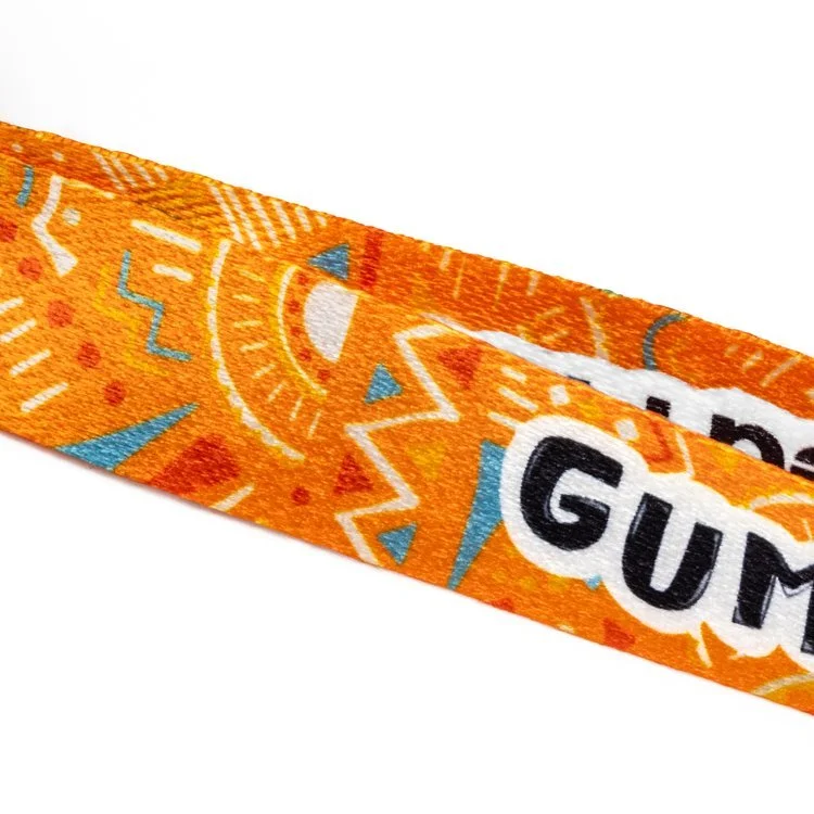 Close up of a dye sublimation printed lanyard showing a full colour pattern across the webbing