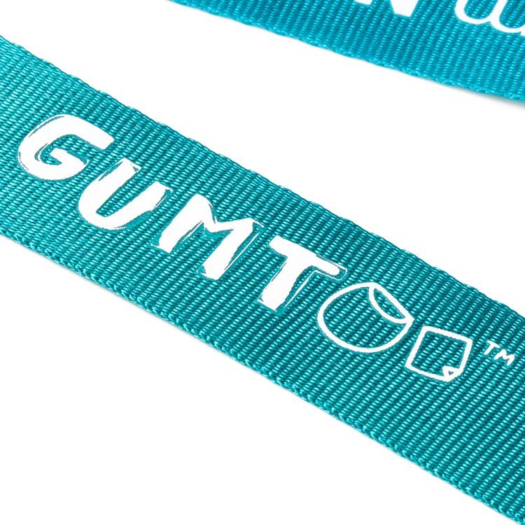Close up of a screen printed lanyard showing a solid spot colour logo on teal webbing