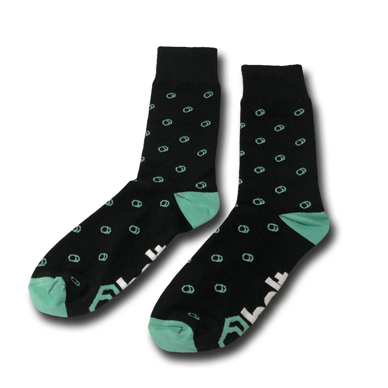Pair of black dress socks with a small repeating mint green motif and contrast heel and toe