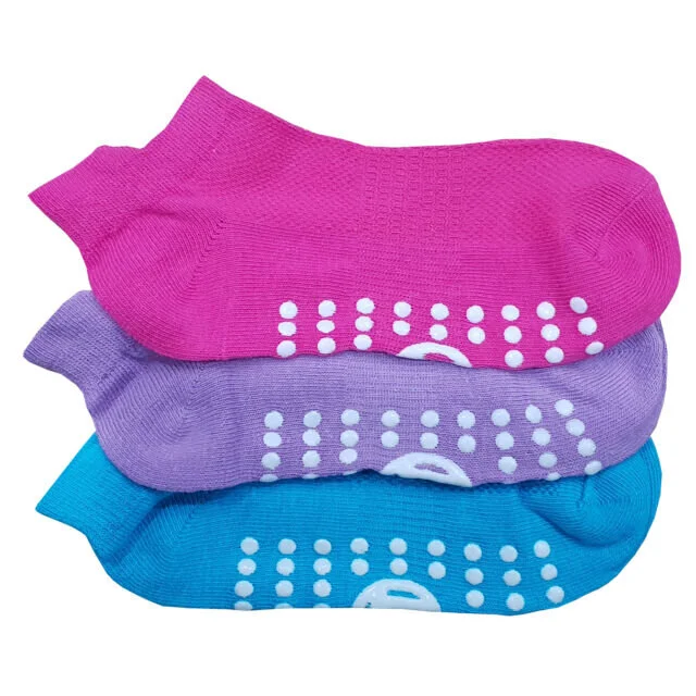 Three stacked ankle socks in pink, purple and blue with white anti-slip grip dots on the soles