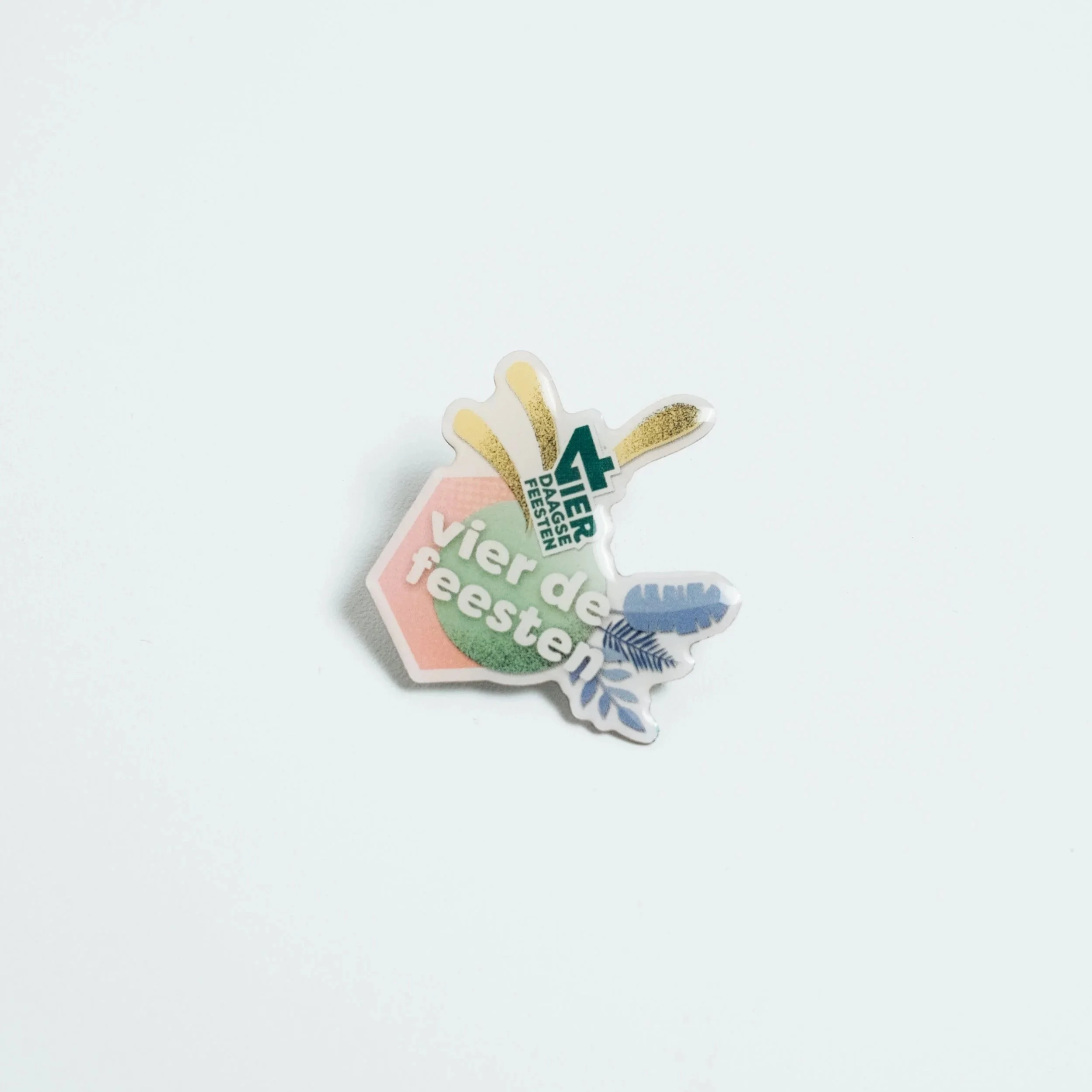 Epoxy enamel pin with a clear resin dome over a printed design