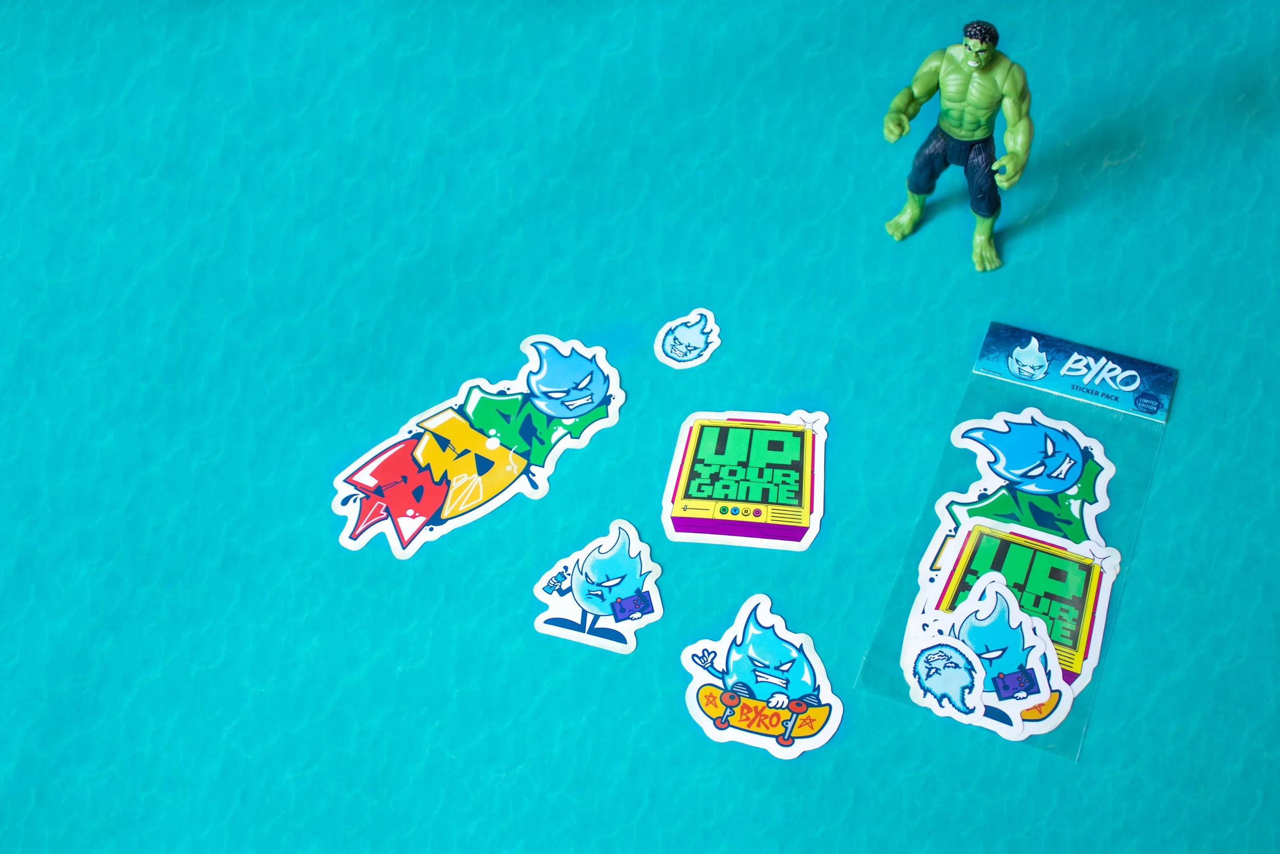 Byro limited-edition sticker pack with blue flame mascot, graffiti lettering and retro "Up Your Game" TV die-cut vinyl stickers