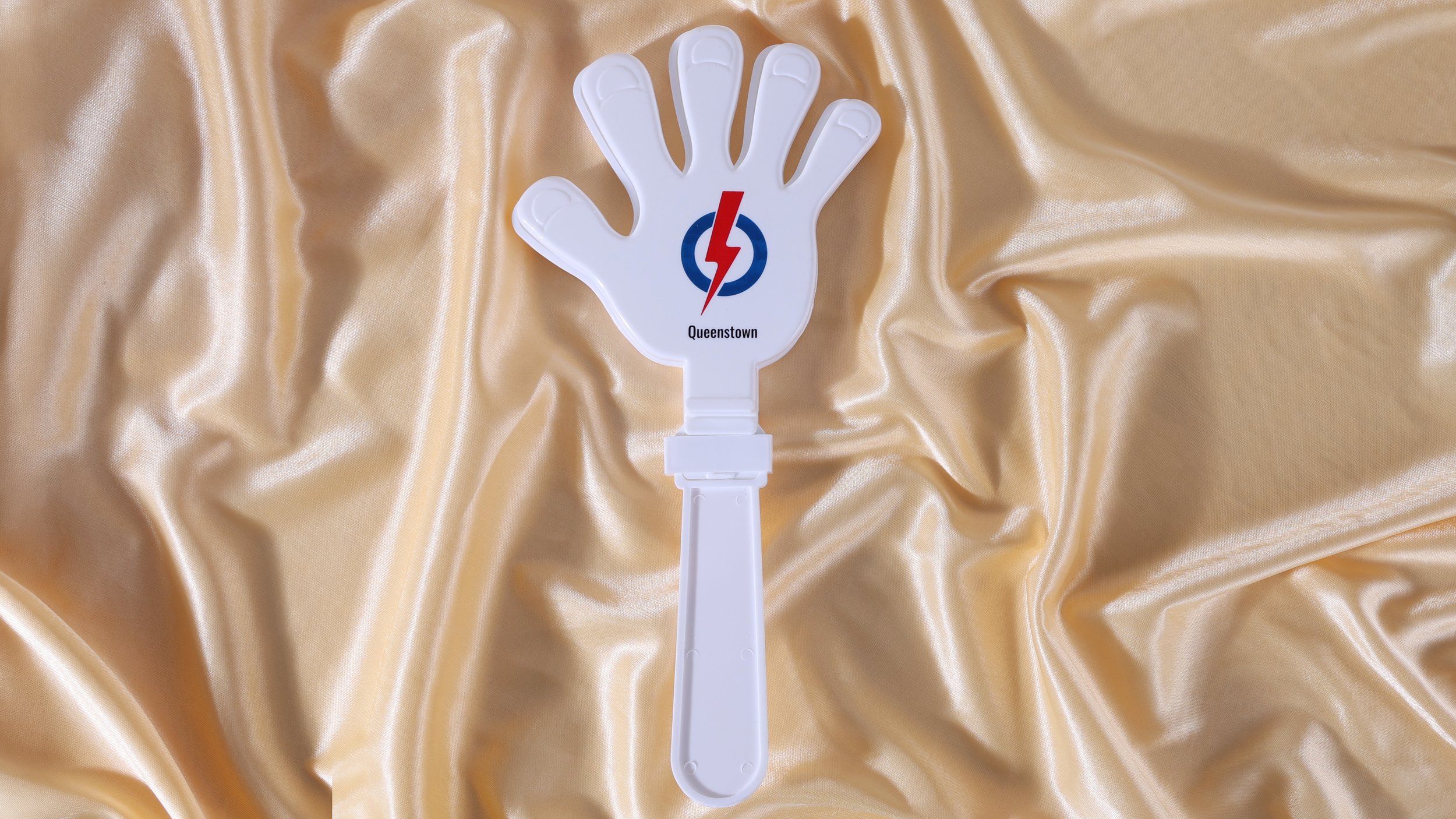 White plastic hand clapper with a two colour logo and branch name printed on the palm