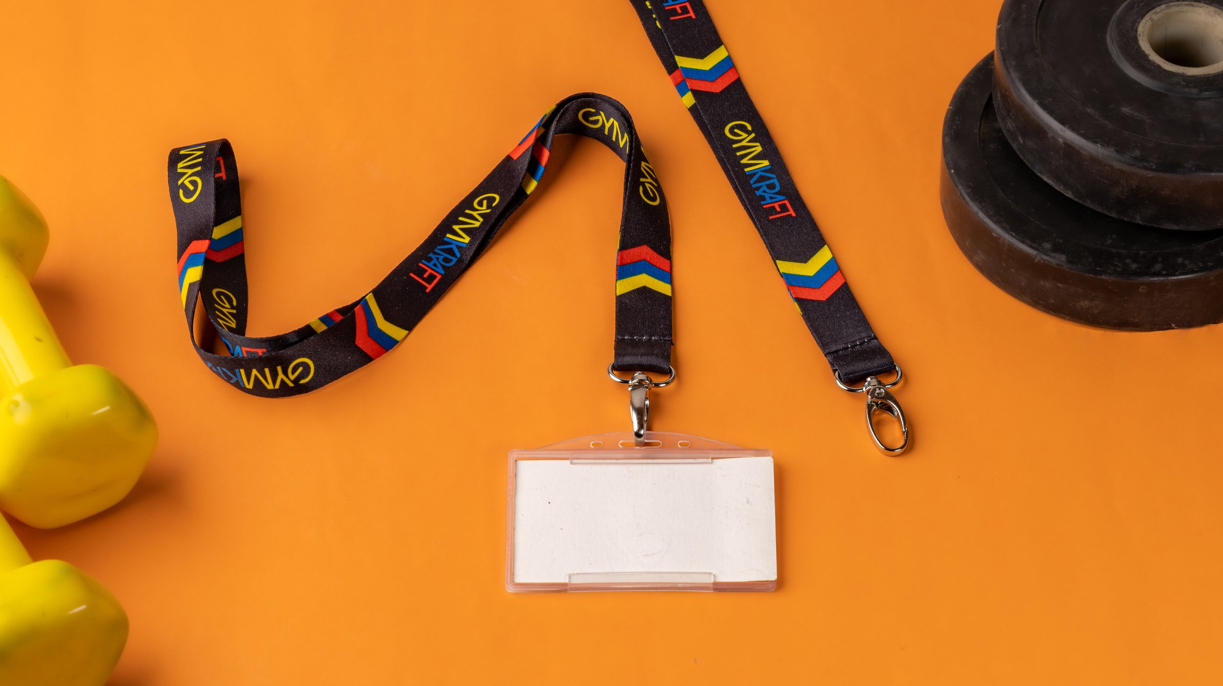 Black GymKraft lanyard printed 
with coloured chevrons, fitted 
with a clear ID card holder