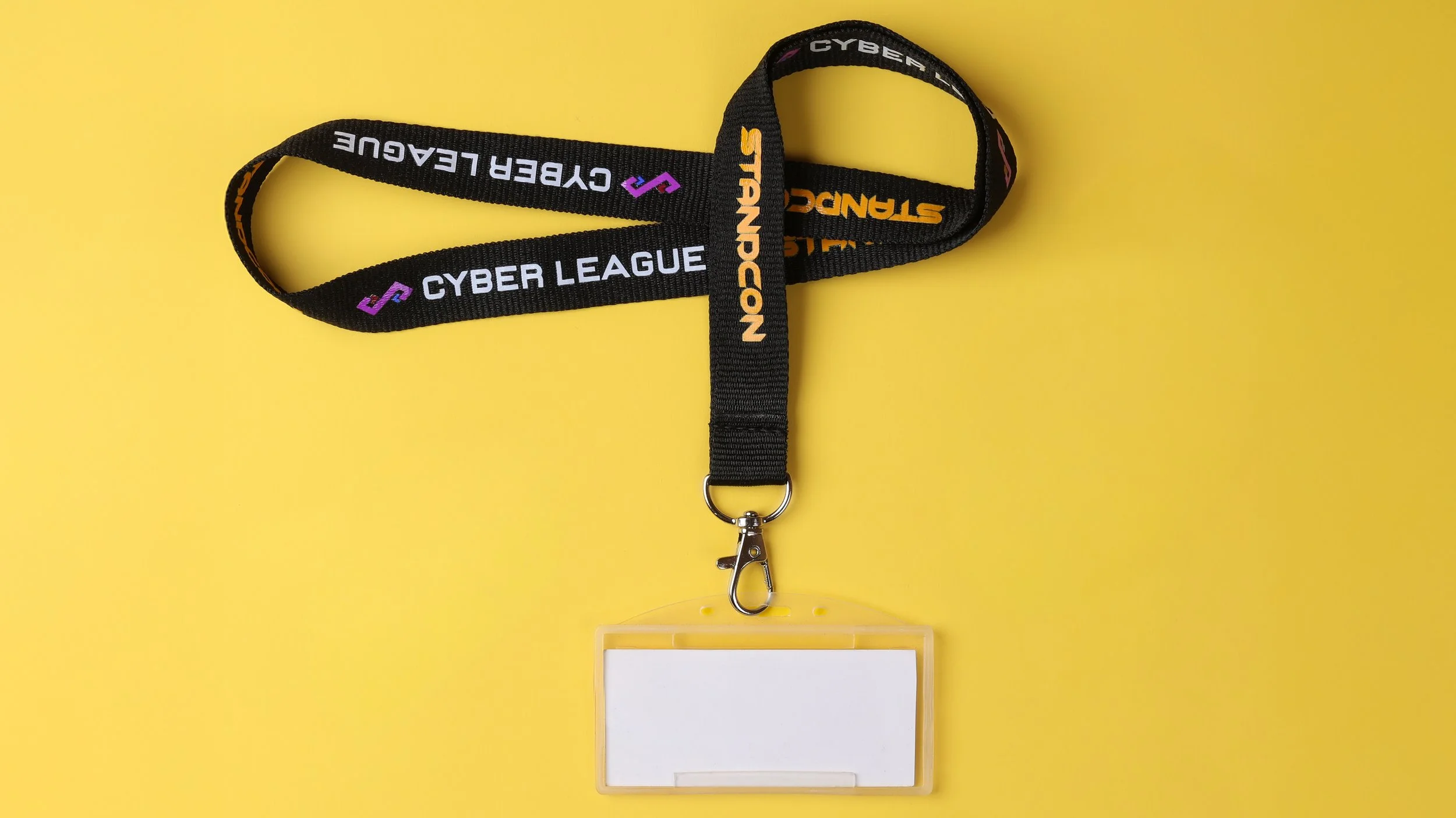 Black woven lanyard printed 
STANDCON and Cyber League, 
fitted with a clear ID card holder