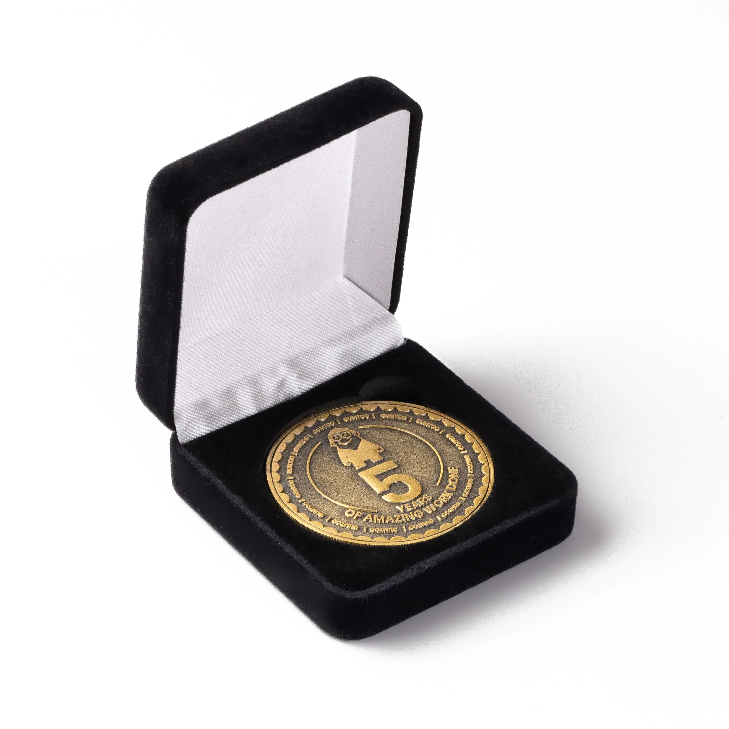 Custom coin in a hinged velvet presentation box with a satin lid
