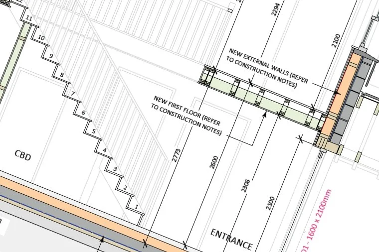 Detailed architectural Building Regulations drawing showing new external walls, first floor, stairs, and entrance area with measurements and construction notes.