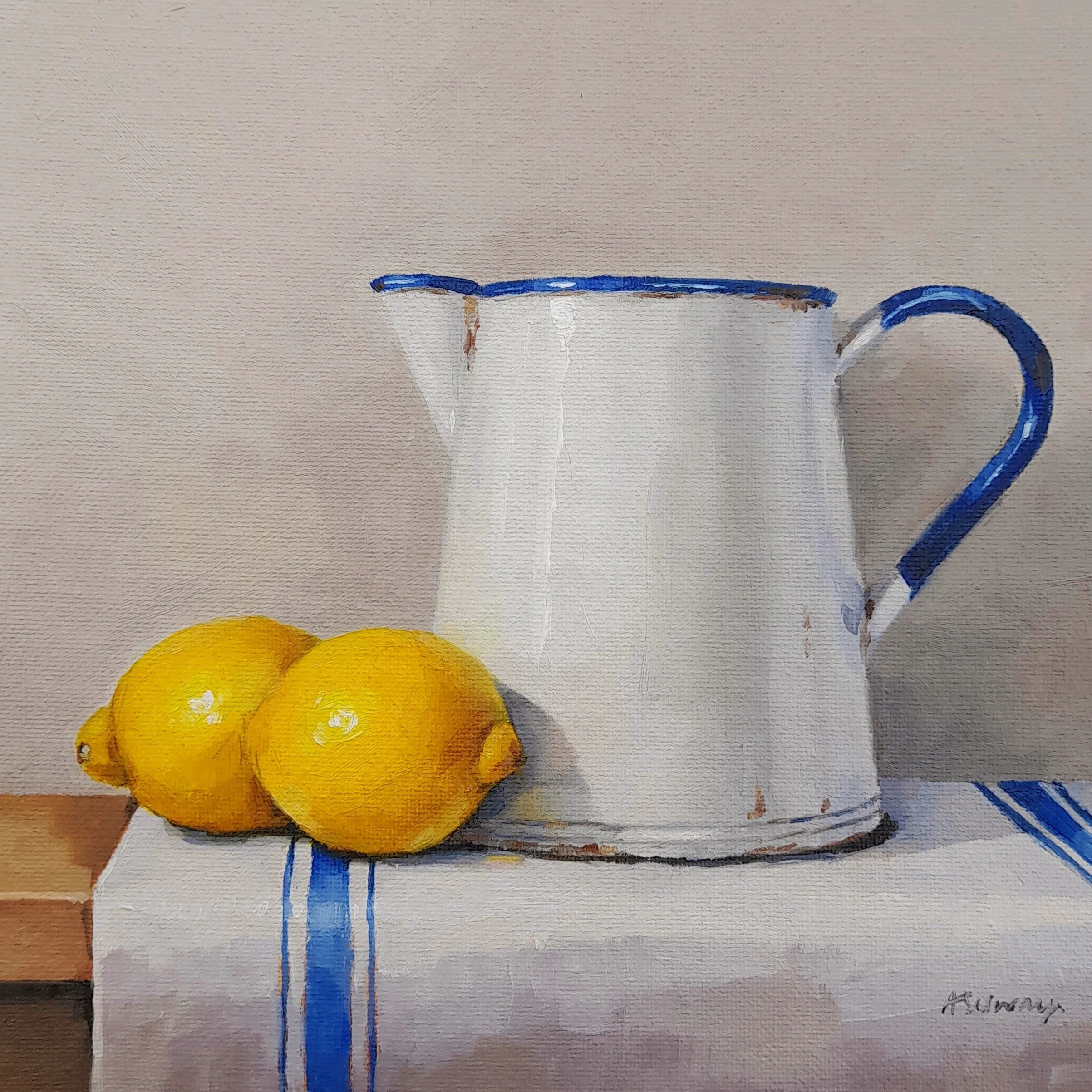 Oil painting by Amanda Selway of a yellow lemon and vintage enamel jug on a white cloth with a blue stripe, in a contemporary realism style.