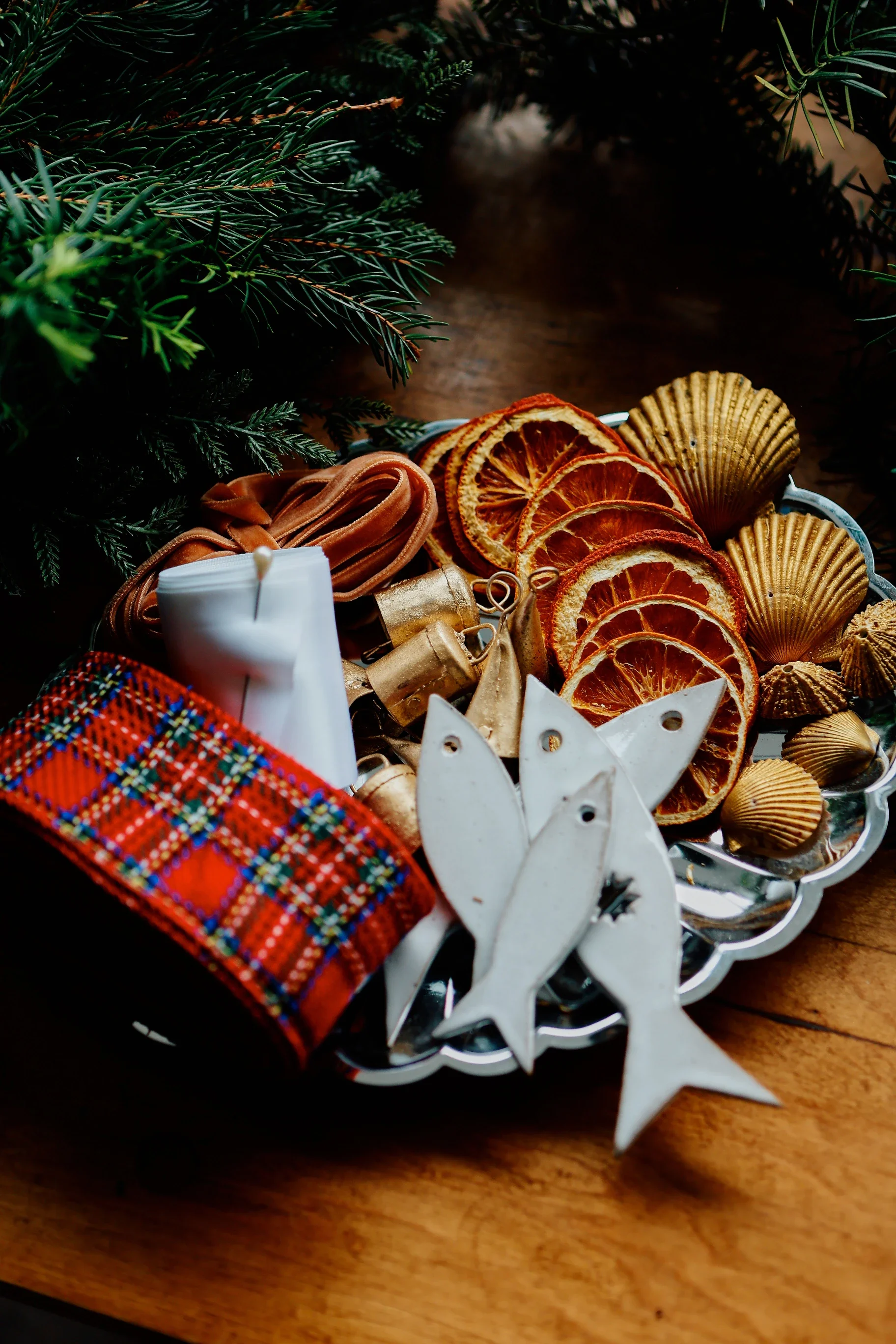 Wreath box with dried oranges, gold shells, ceramic fish and plaid ribbon