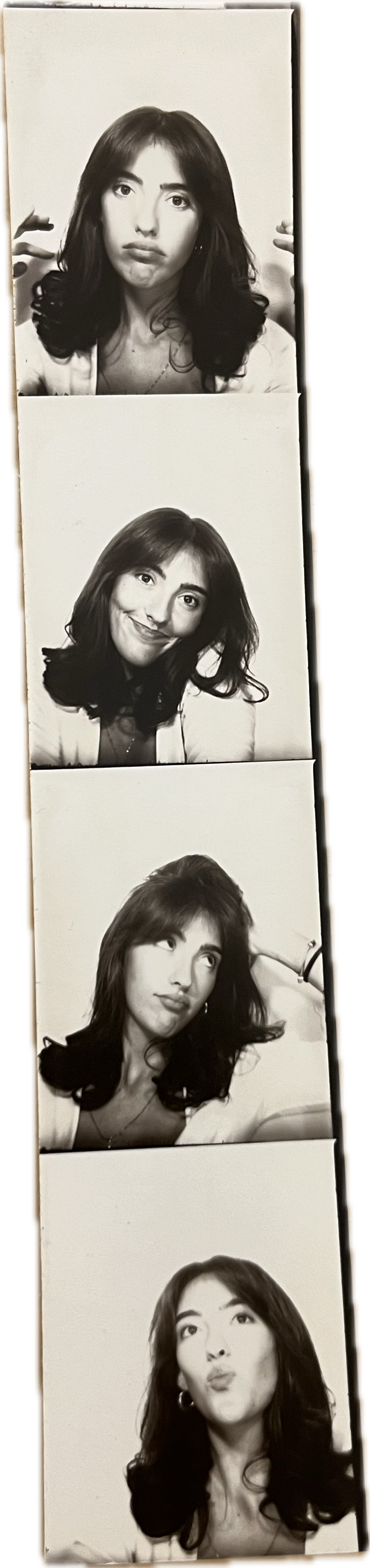 Black and white photo booth strip featuring a woman making various facial expressions, including a pout, a smile, a thinking pose, and a kiss face.