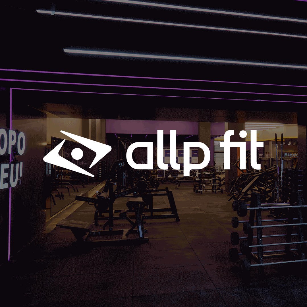 Interior of a gym with workout equipment, purple lighting, and the Allpfit logo overlay.