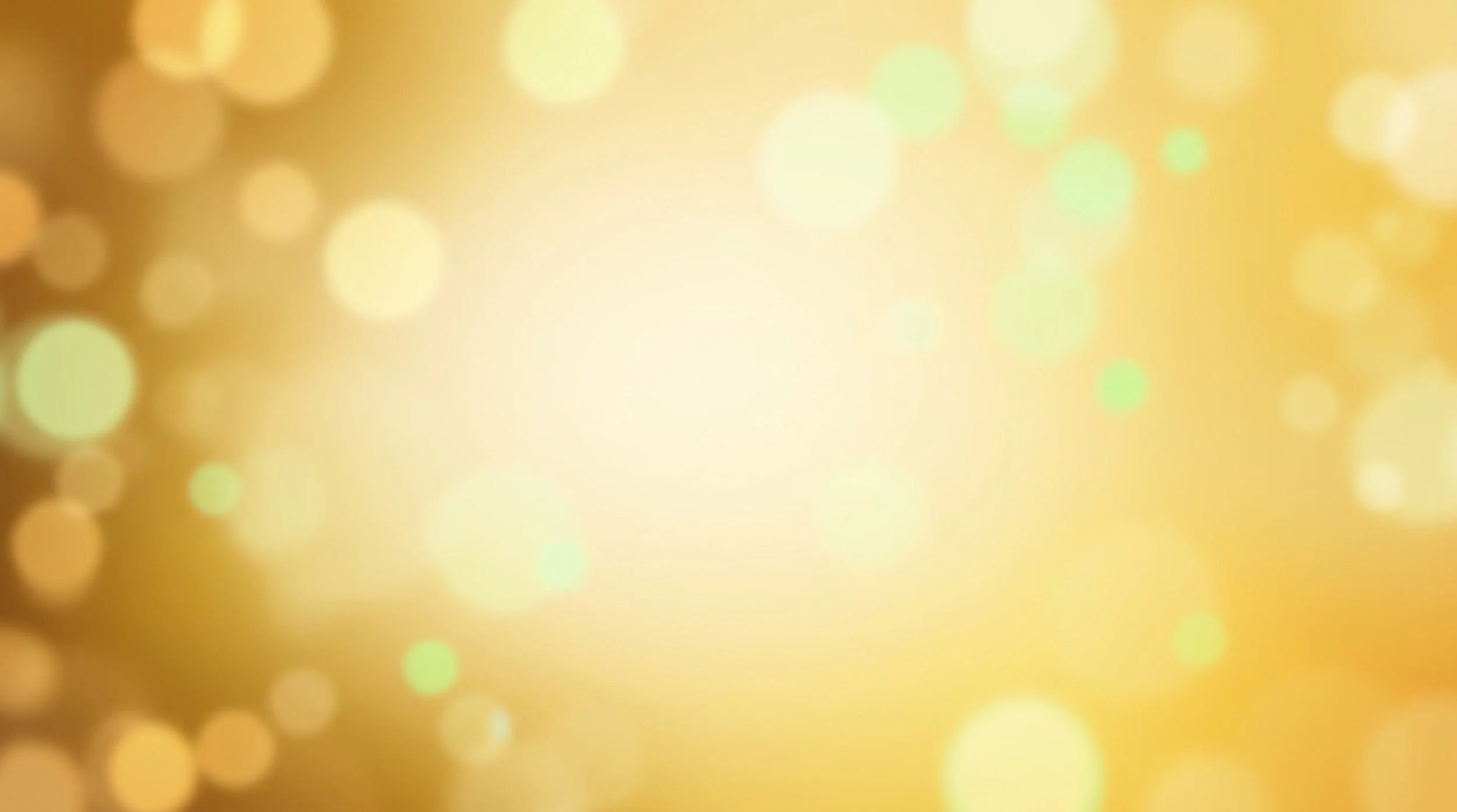 Das Bild zeigt eine unscharfe, goldene, bokehartige Hintergrundgrafik mit runden, leuchtenden Lichtpunkten unterschiedlicher Größe.