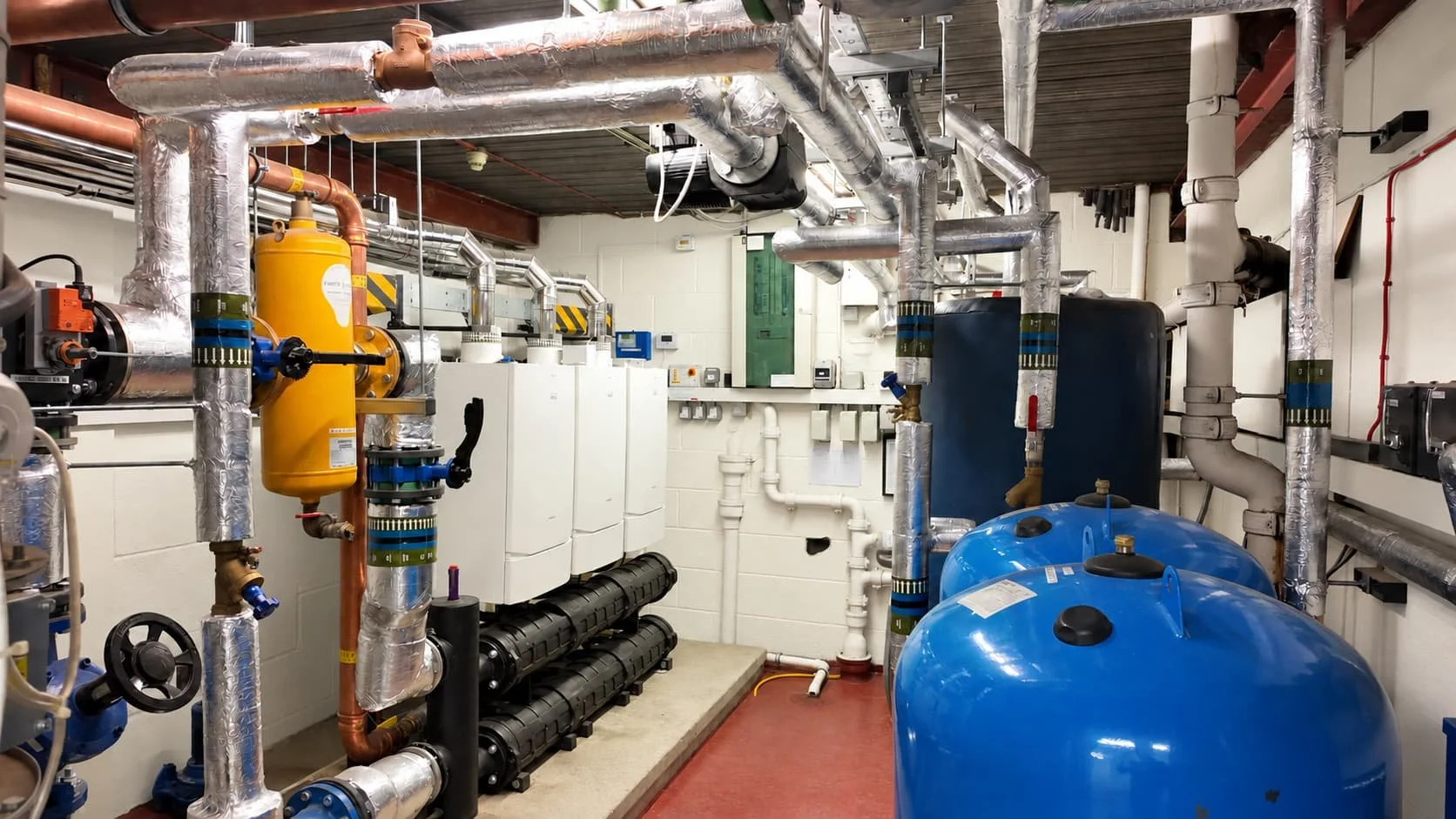 Refurbished communal boiler house at Crompton Court, London, with three condensing boilers