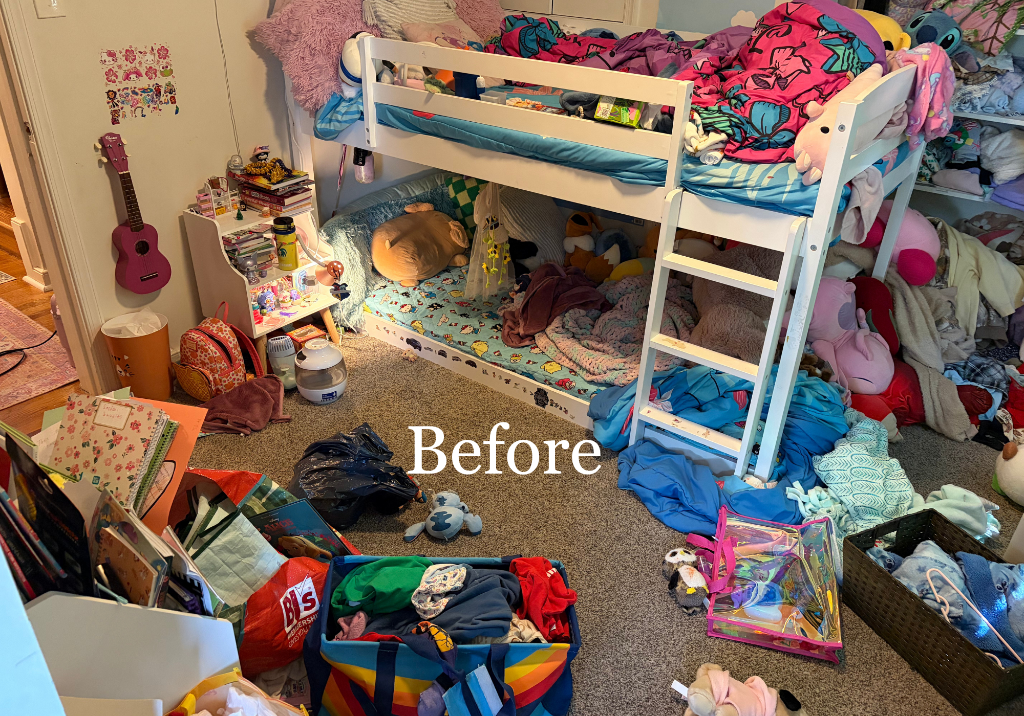 A cluttered bedroom with a bunk bed, the top bunk has colorful blankets and stuffed animals, while the bottom bunk contains more stuffed animals and blankets. There's a small desk with books, toys, and a water bottle on the left, and various piles of