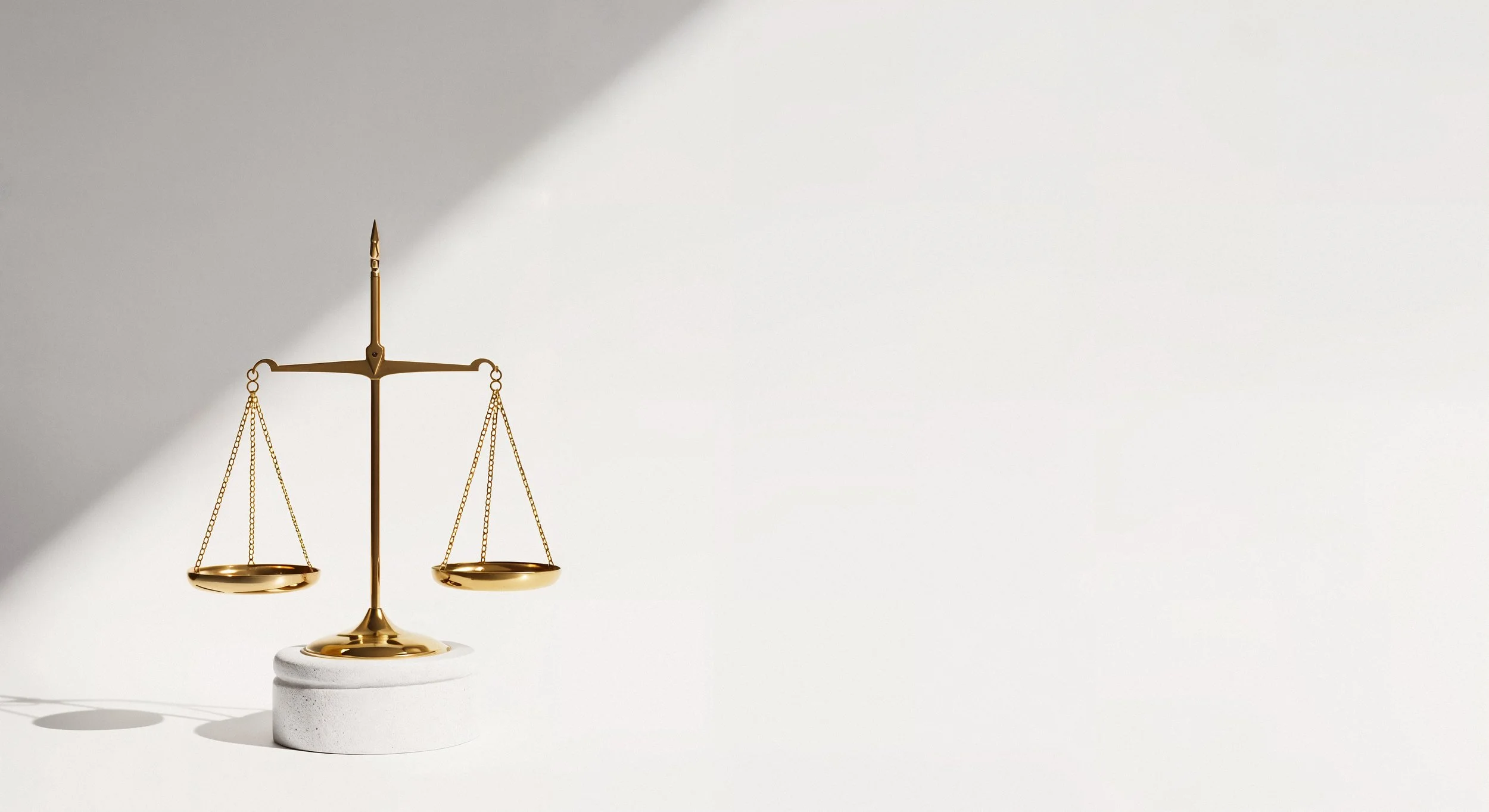 Brass balance scales representing legal and administrative services in Portugal.