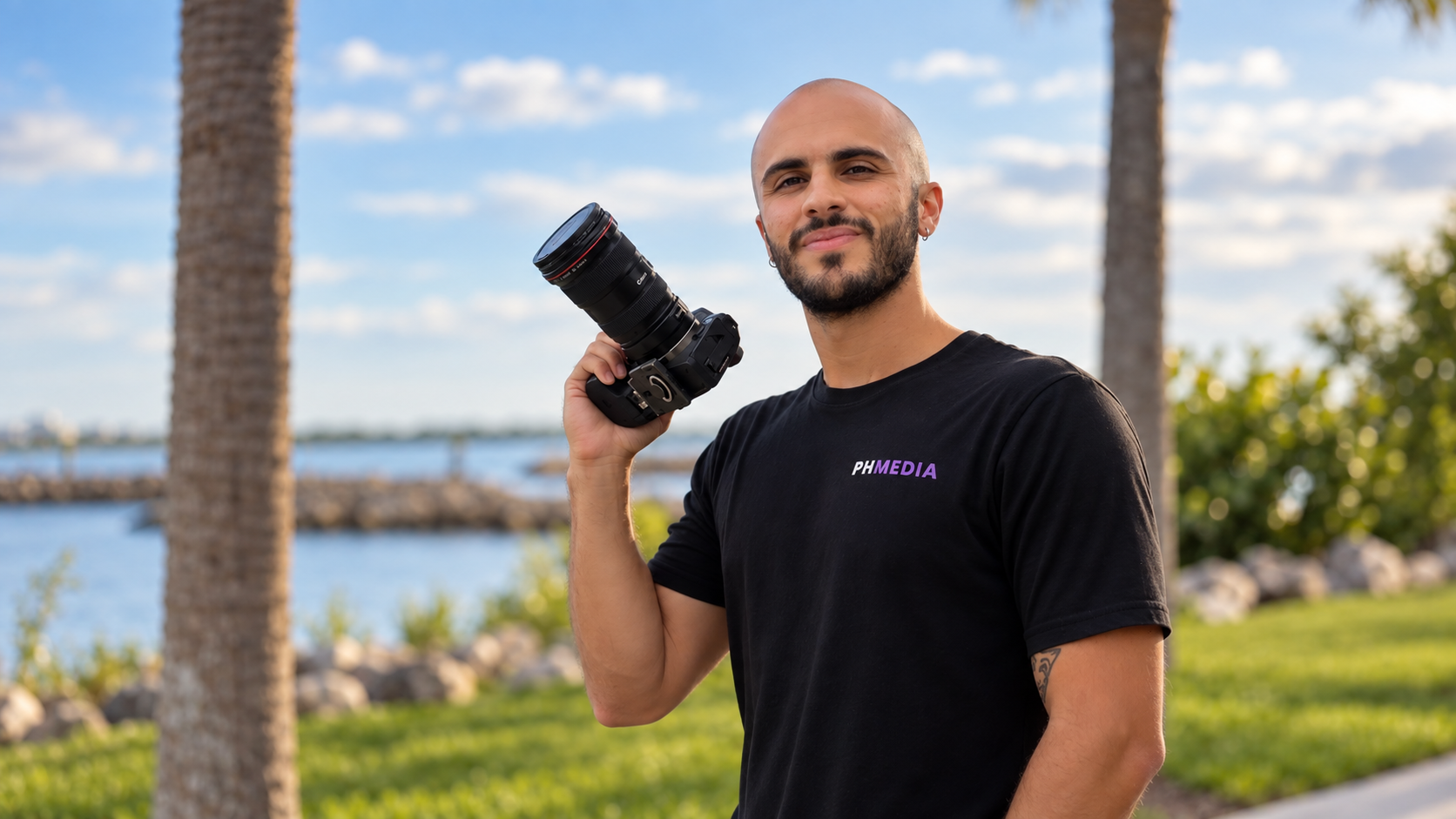 A professional real estate photographer looking into the camera very welcoming and excited to do his job