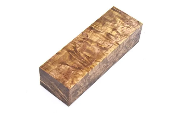 A rectangular block of stabilized curly birch wood with a natural grain pattern.