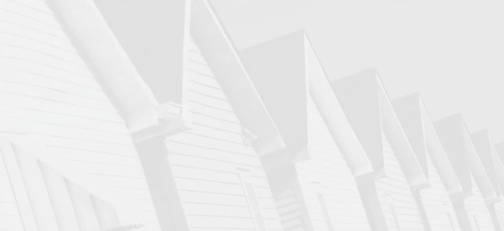 A row of house gutters with soffit vents on a residential building.