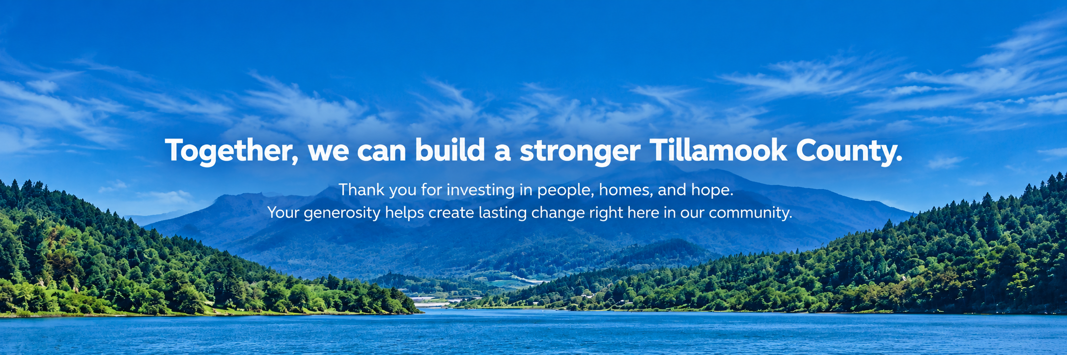 Scenic landscape of a lake surrounded by green forested hills and mountains under a blue sky with white clouds, featuring an overlaid message about building a stronger Tillamook County.