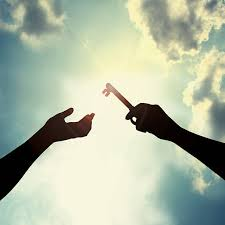 Silhouette of two hands reaching toward the sky, one holding a key, with a bright sun and clouds in the background.