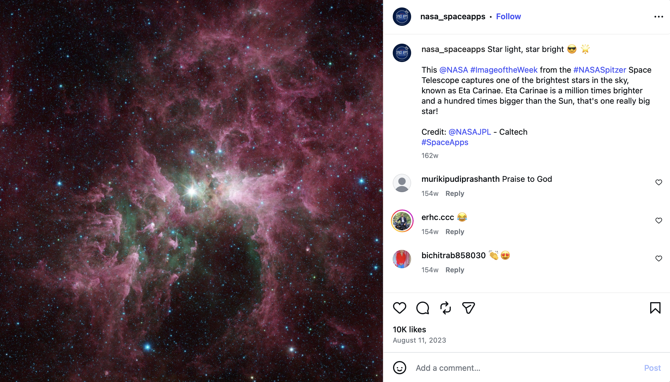 Colorful image of a star-forming region in space with dense pink and green nebula clouds and bright stars scattered throughout.