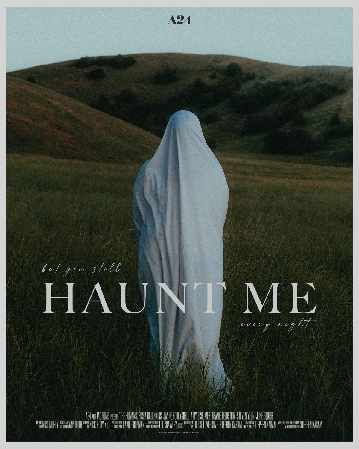 A person in a white sheet stands in a grassy field with rolling hills in the background at dusk. Text on the image reads, 'but you still HAUNT ME every night'.