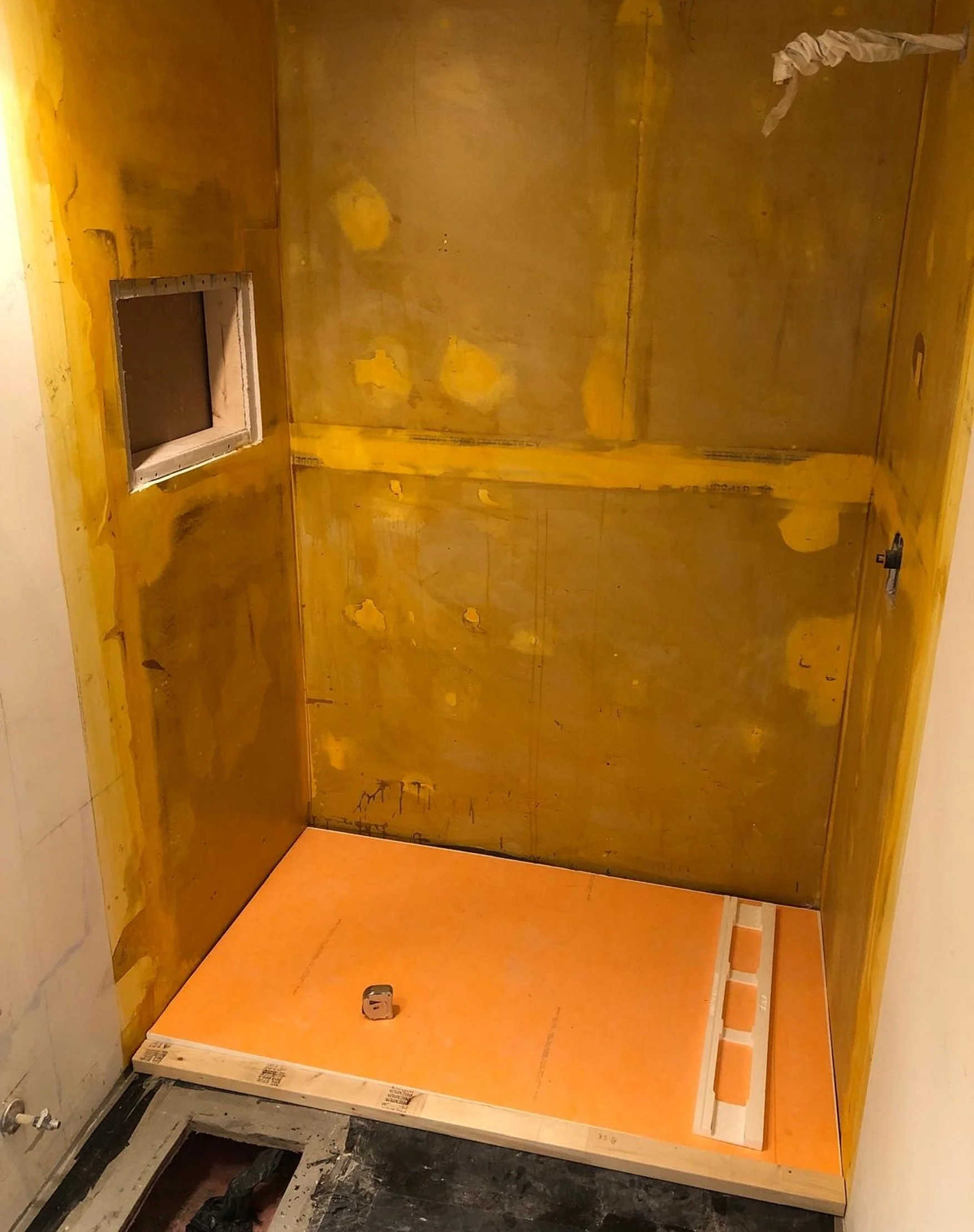 The shower fully framed and primed, right before the Schluter Kerdi membrane goes on to waterproof it before tile.