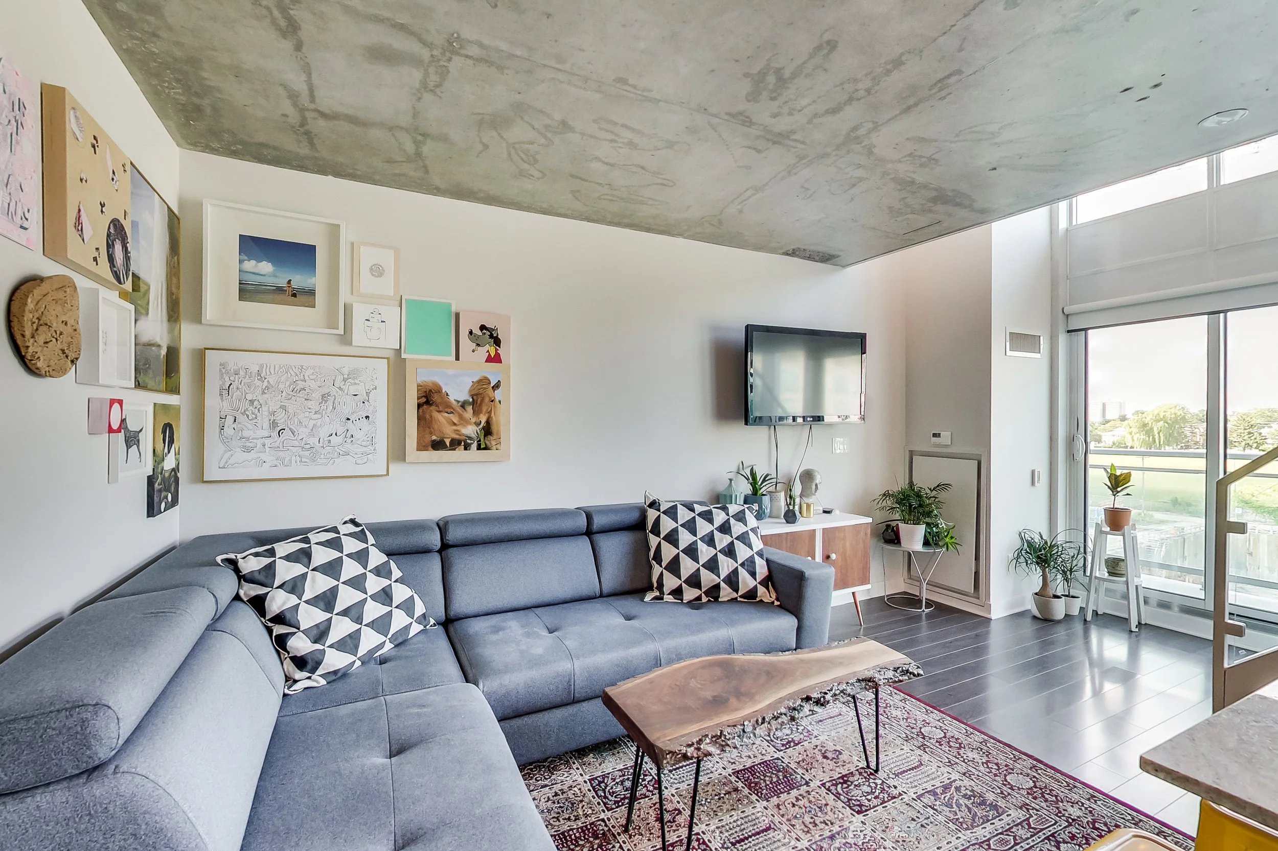 Toronto loft renovation with exposed concrete ceiling and fresh interior painting