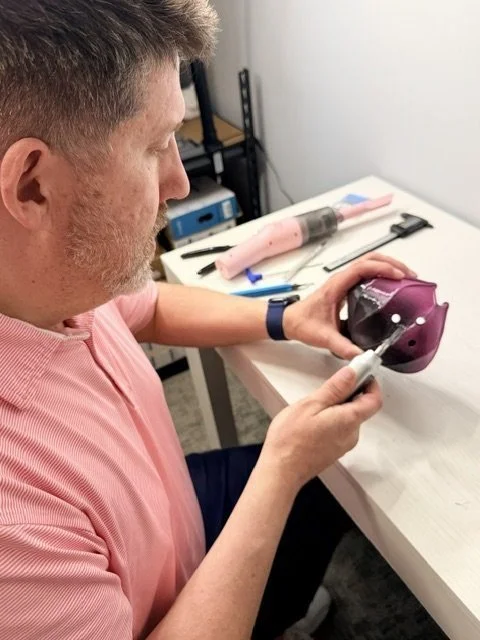 Joe sanding the edges of a 3D-printed planter at the workbench