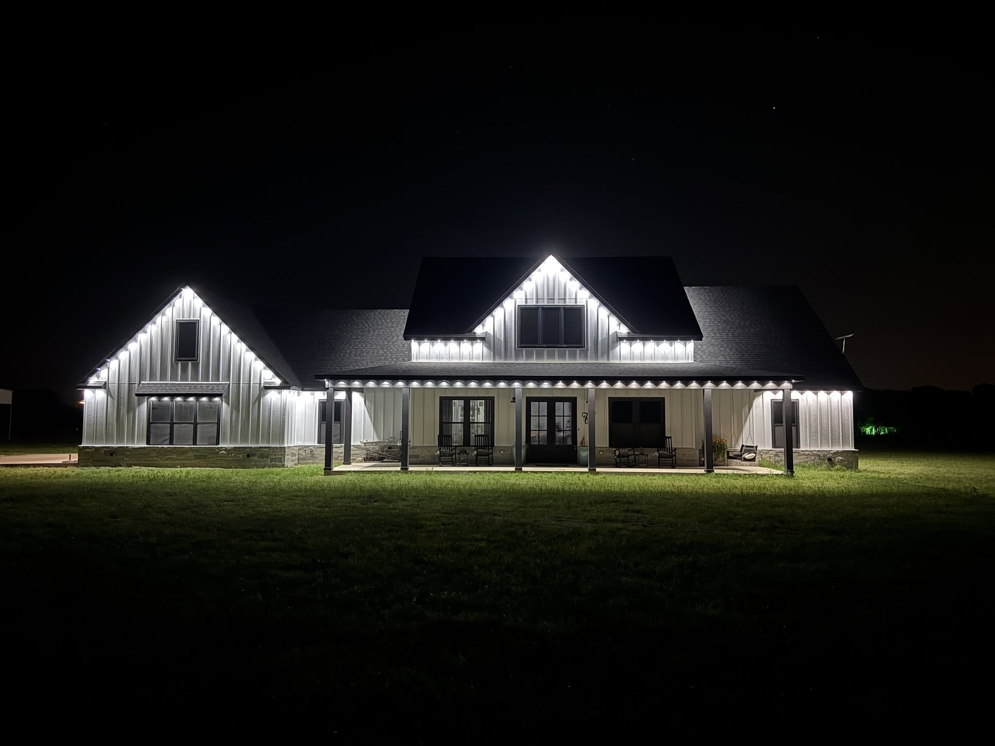 Christmas lights outlining the roofline of a Waco area home