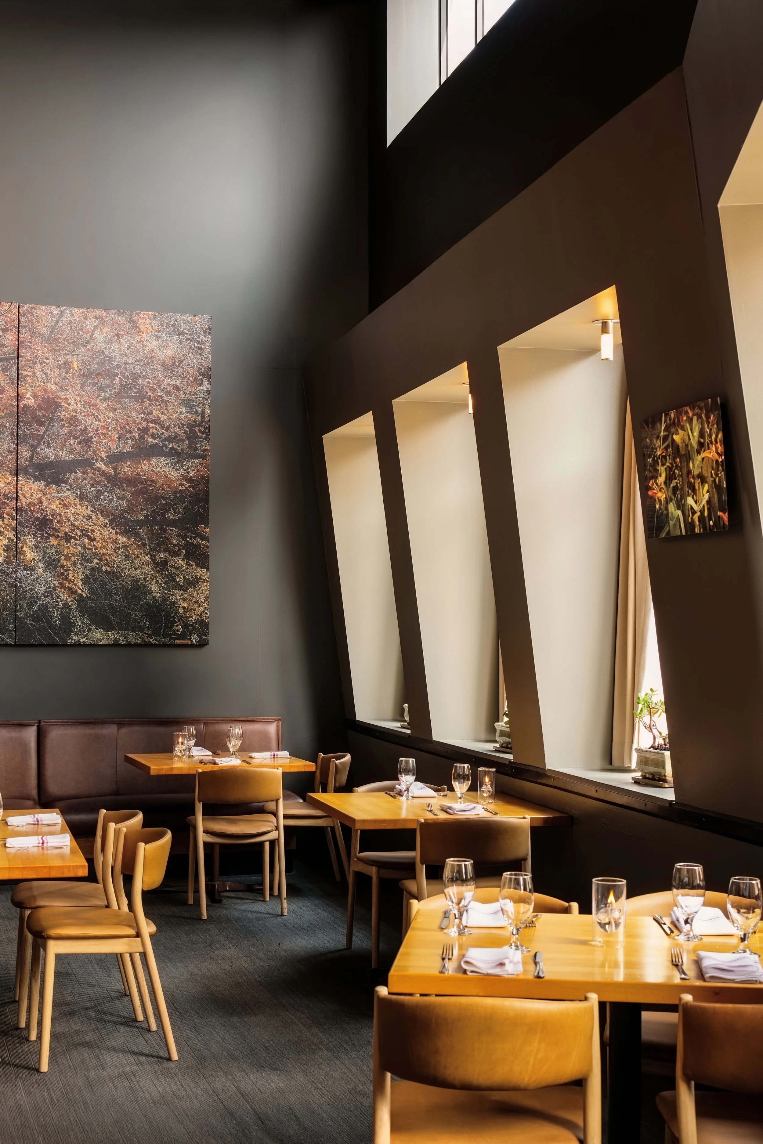 Hospitality — Architectural restaurant detail with layered seating and ambient light, photographed for a destination brand.