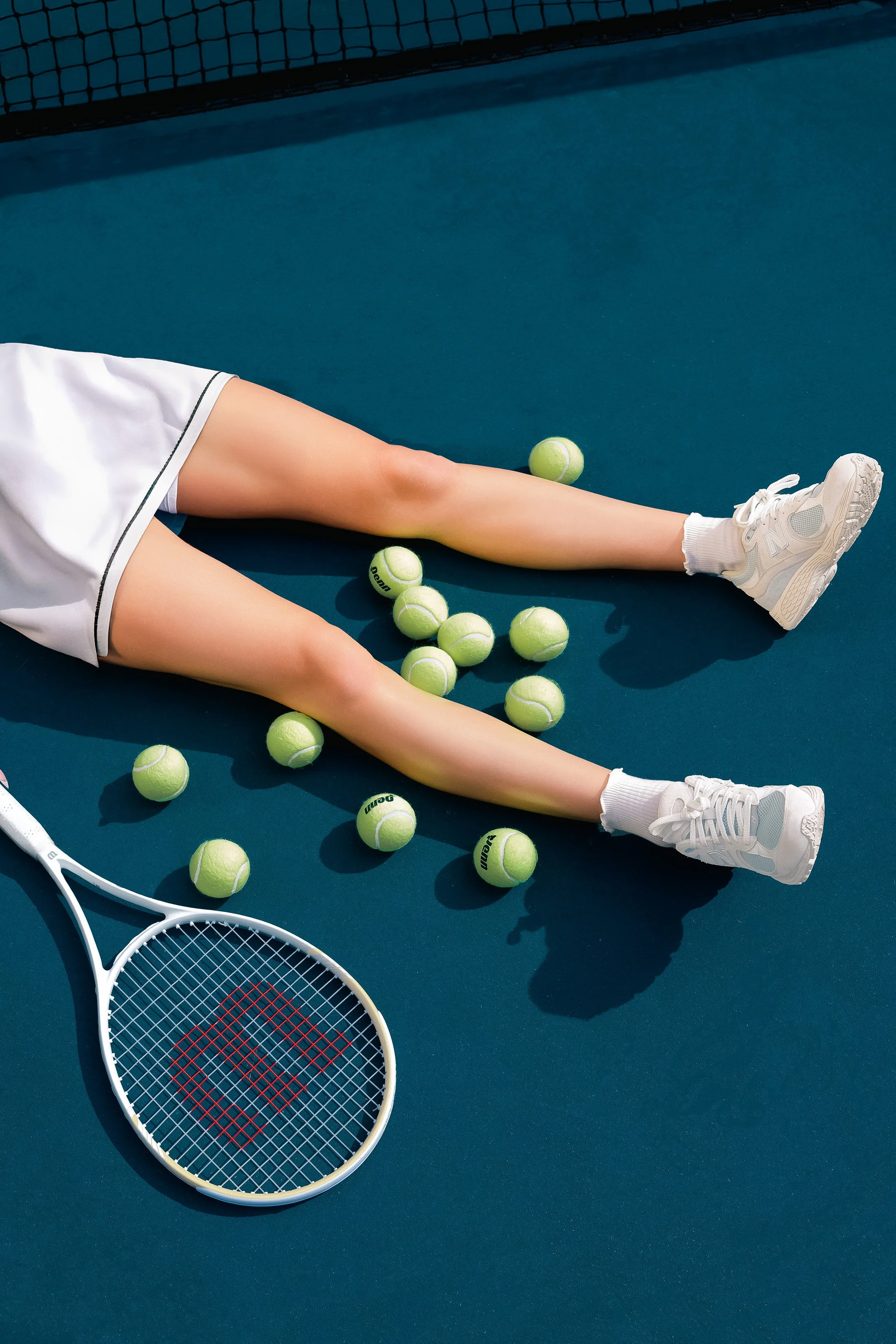Editorial & Brand — Tennis player Alina photographed on court for an elevated editorial sports campaign.
