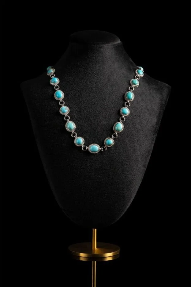Luxury Jewelry — Turquoise necklace presented on black for a refined product campaign.