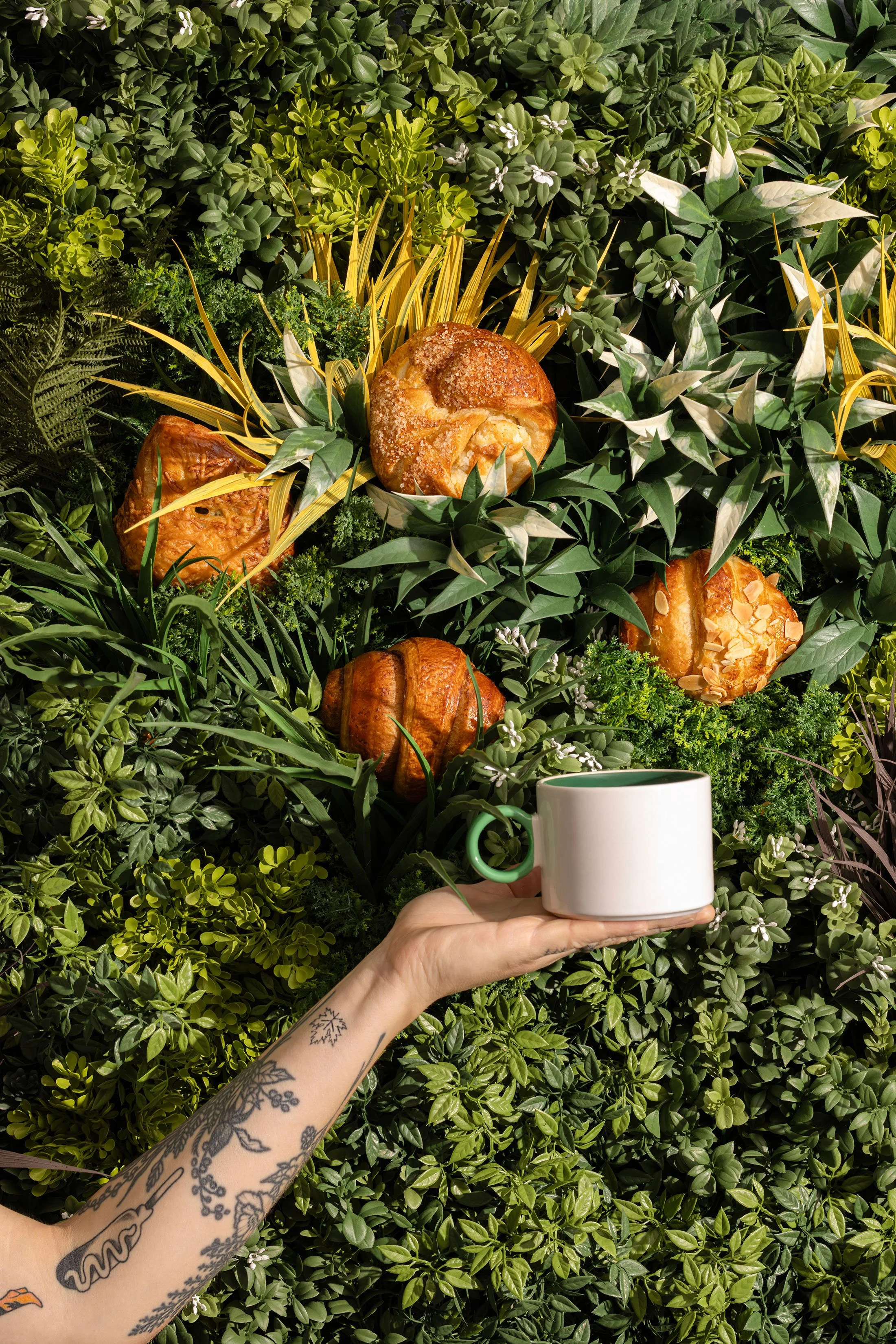 Fresh croissants arranged outdoors for an editorial bakery and hospitality campaign by Fraiche Photography.