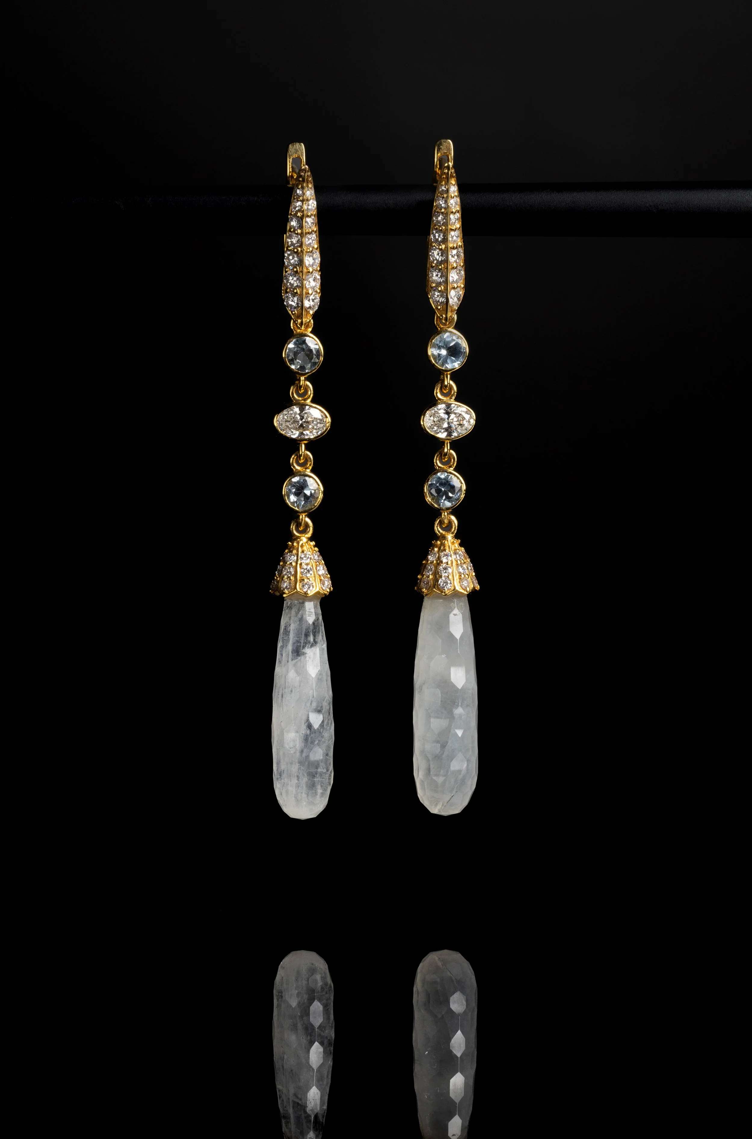 Luxury Jewelry — Long gemstone drop earrings photographed on black for a refined product campaign.