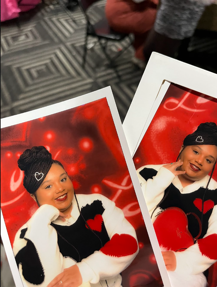 Photographs of a young woman with braided hair wearing a black beanie with a heart, posing with her hand resting on her chin against a red background with heart and light patterns, displayed on white photo frames.