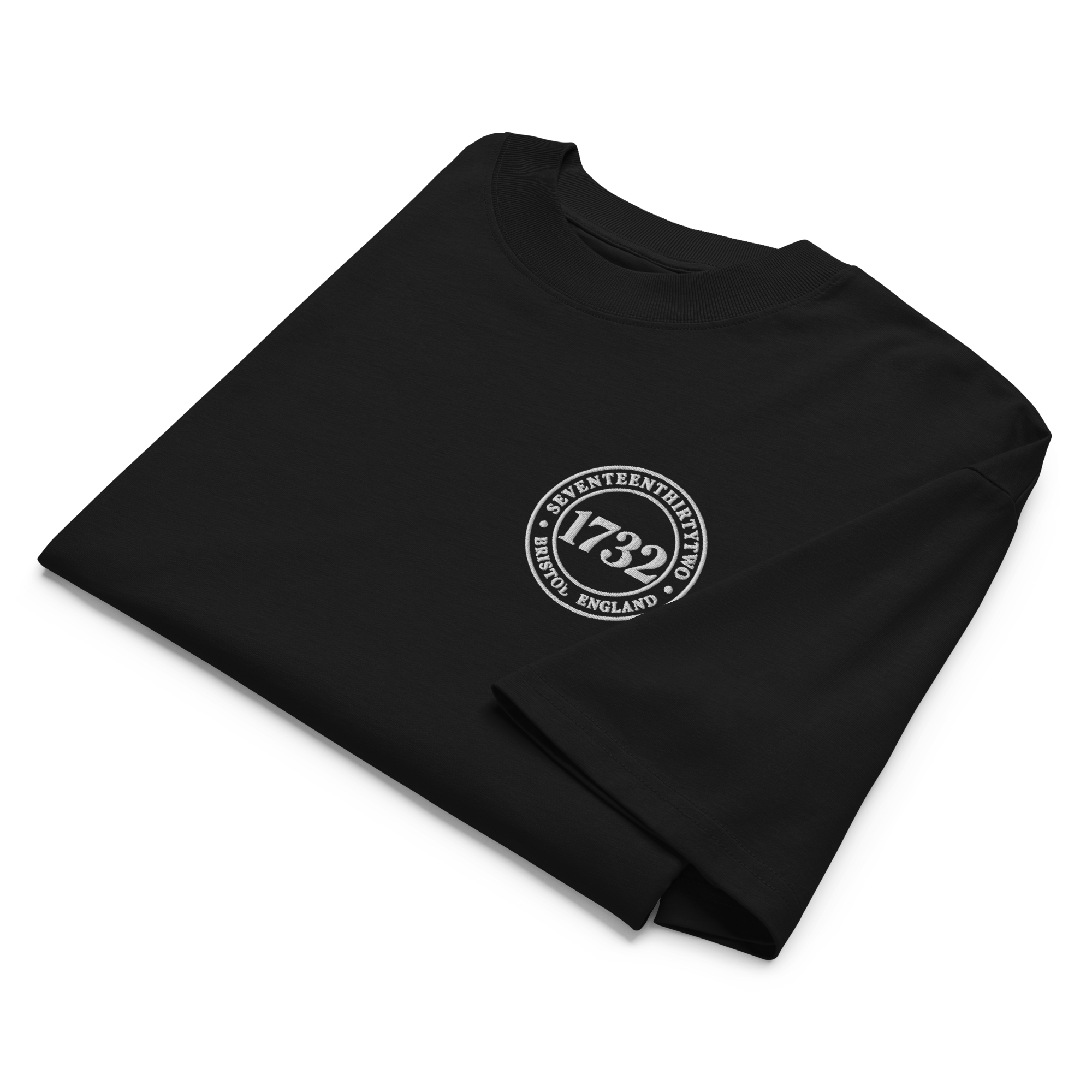 Black t-shirt with white circular logo reading 'Seventeenthirtytwo' and '1732' and other small words.