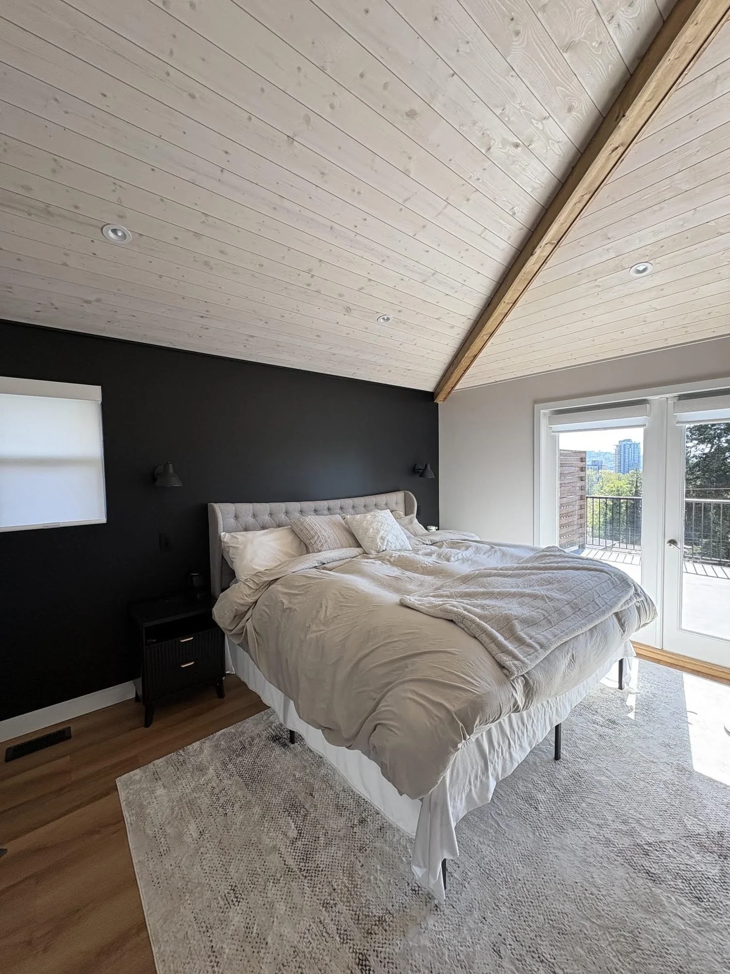 06-bedroom-vaulted-ceiling-pot-lights-sconces.jpg