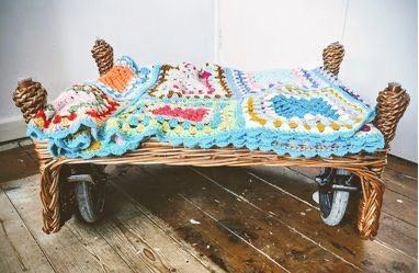 'Belly Rolls' is an assemblage made using wheels, a crochet blanket and a wicker bed belonging to my best friend. By including a pet seat in the 100 Wheeled Chairs project I highlight the importance of multi-species design