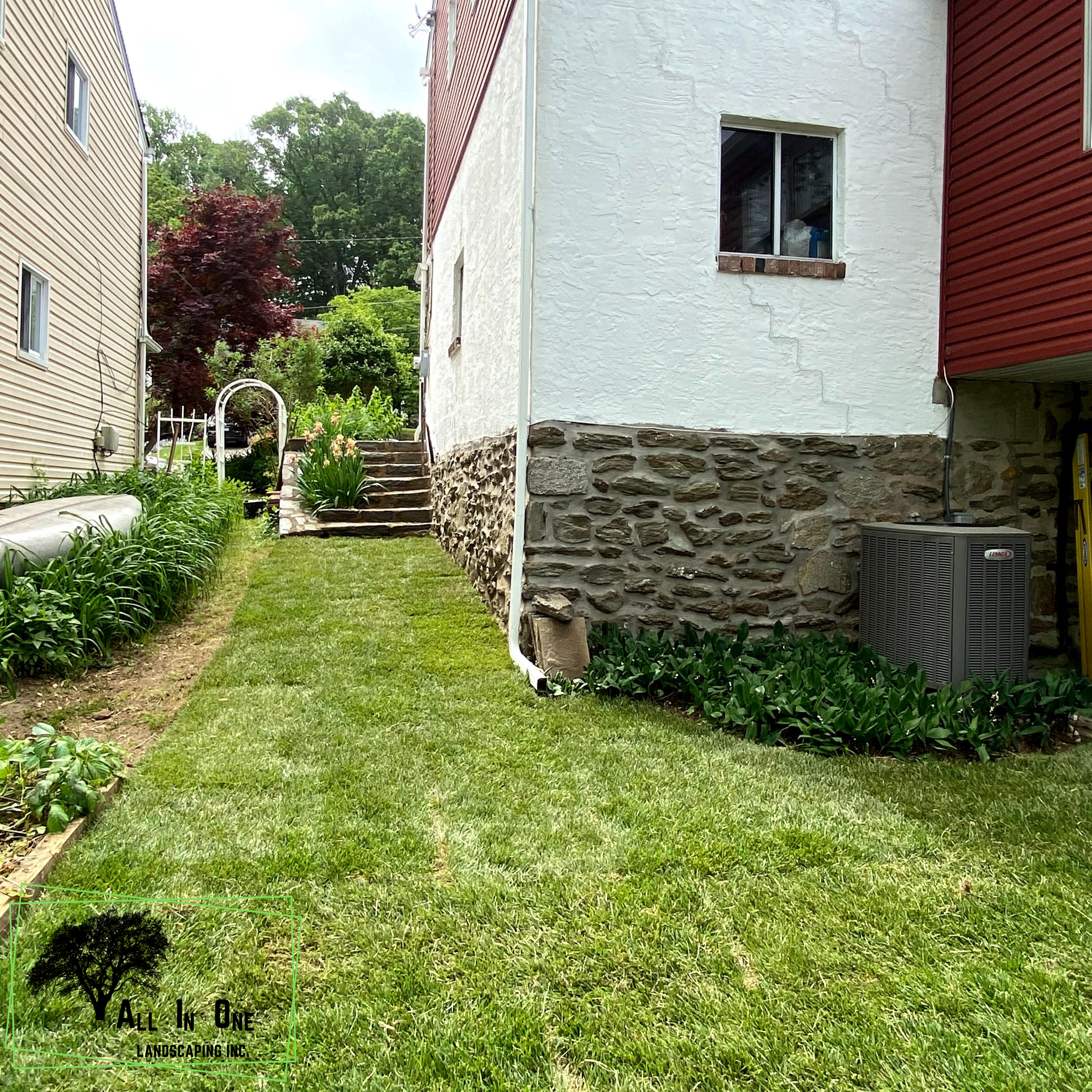 Professional lawn mowing and landscape maintenance using a zero-turn mower to maintain a residential lawn, keeping the grass neatly trimmed and the property looking well-maintained.