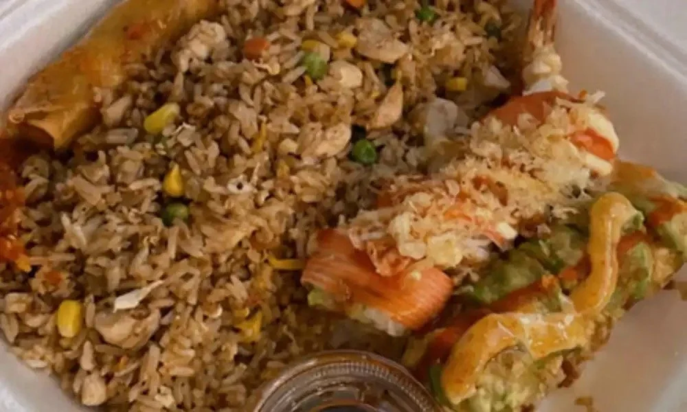 Fried rice with vegetables and chicken spring rolls with dipping sauce