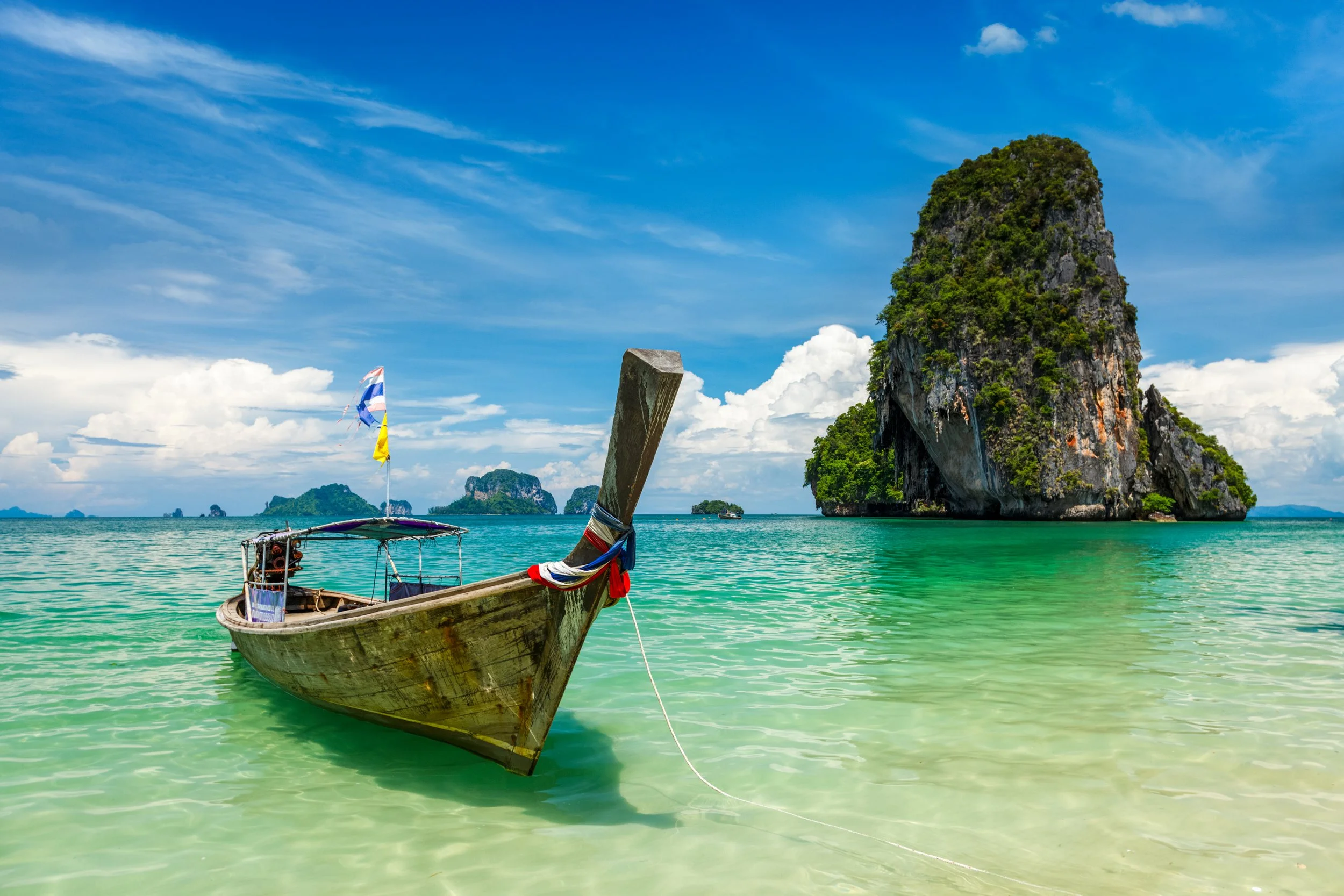 vecteezy_long-tail-boat-on-beach-thailand_45378994.jpg