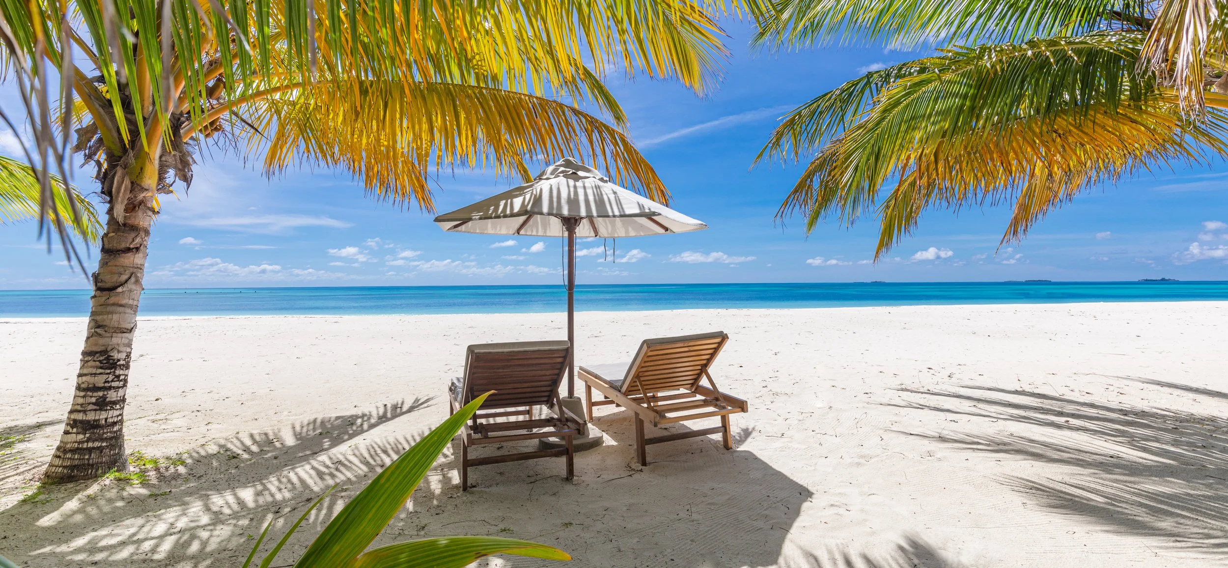vecteezy_tranquil-tropical-beach-summer-landscape-with-chairs-and_19030767.jpg