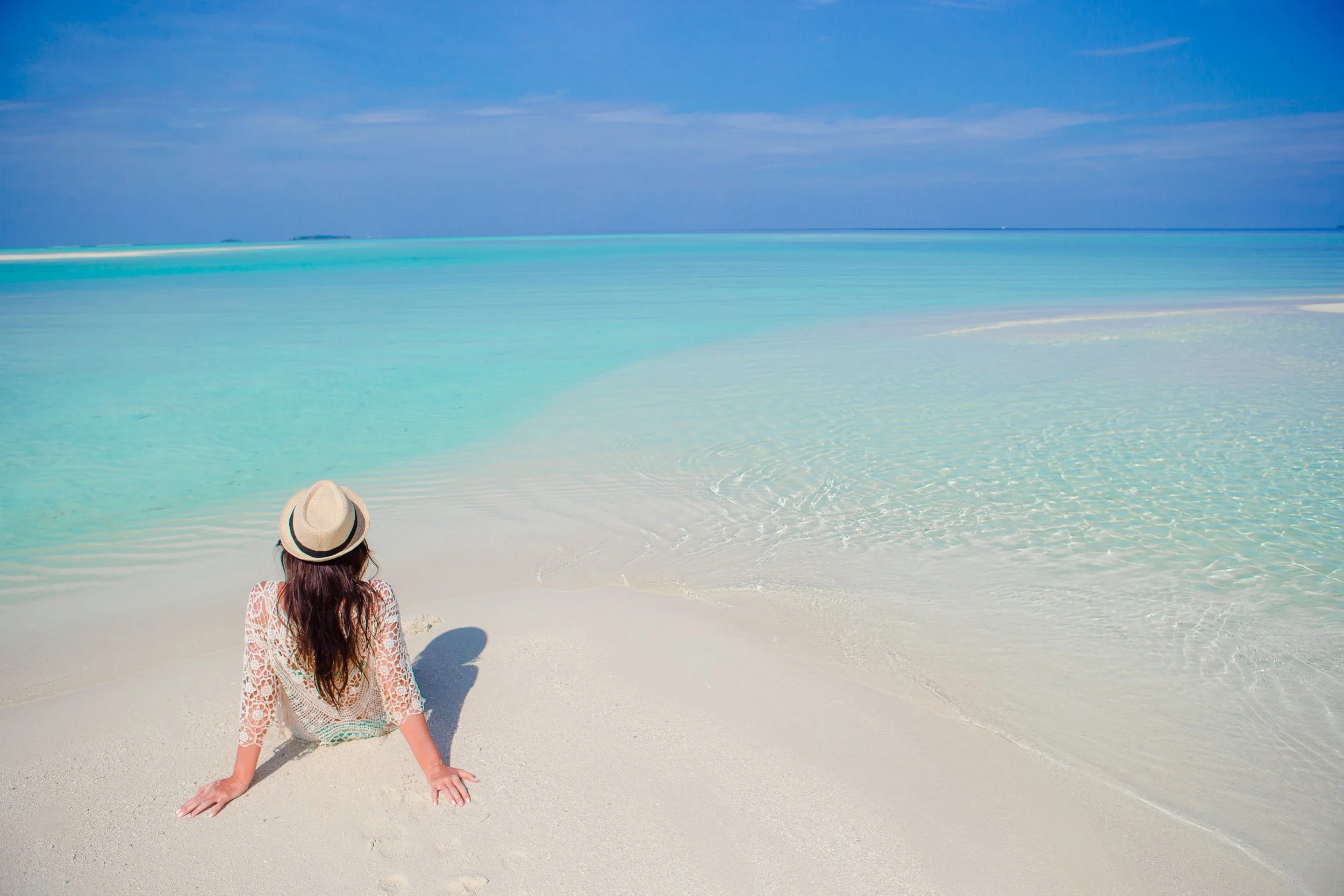 vecteezy_young-woman-enjoy-tropical-beach-vacation-on-maldives_18047865.jpg