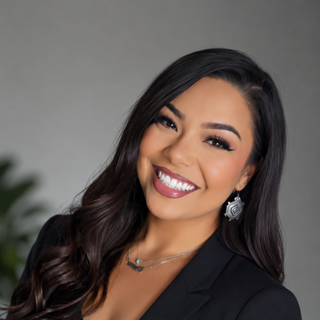 A professional headshot of Taciana Torrez