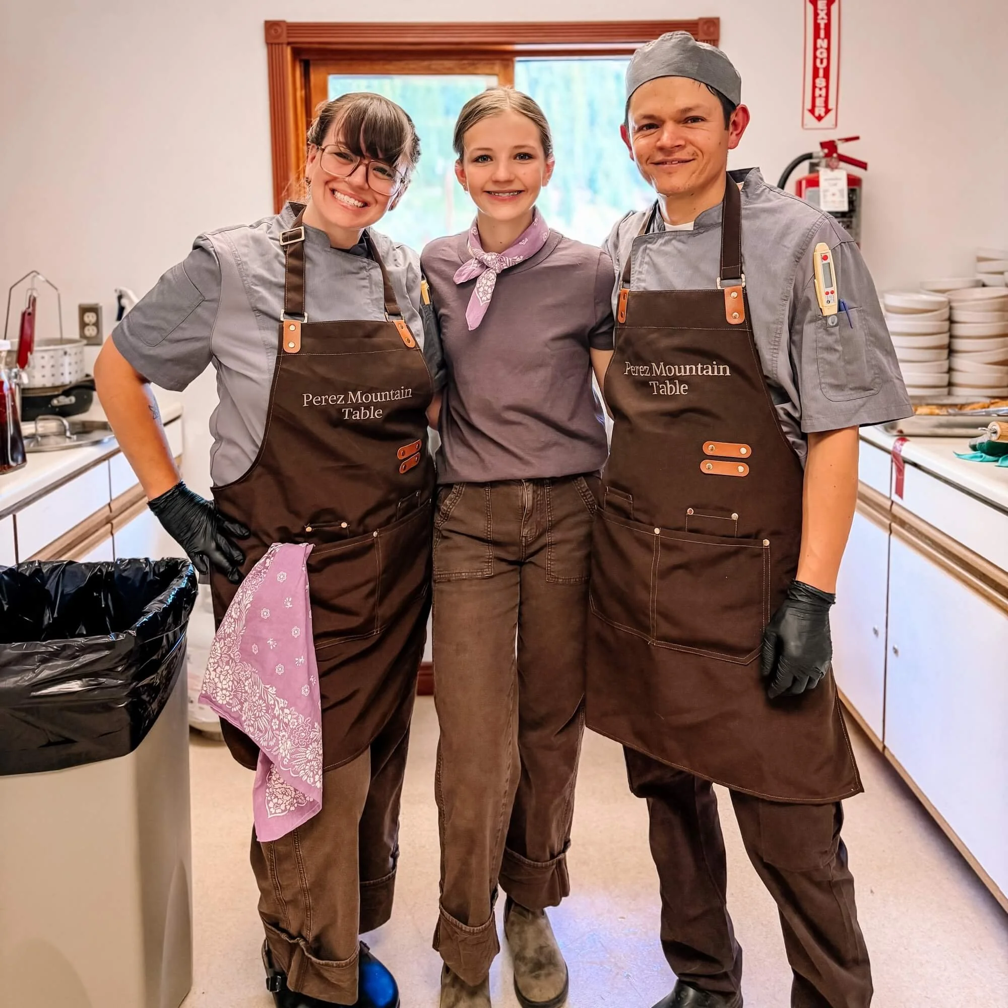 Katie, Chef Chuy and their student team in the kitchen at Perez Mountain Table